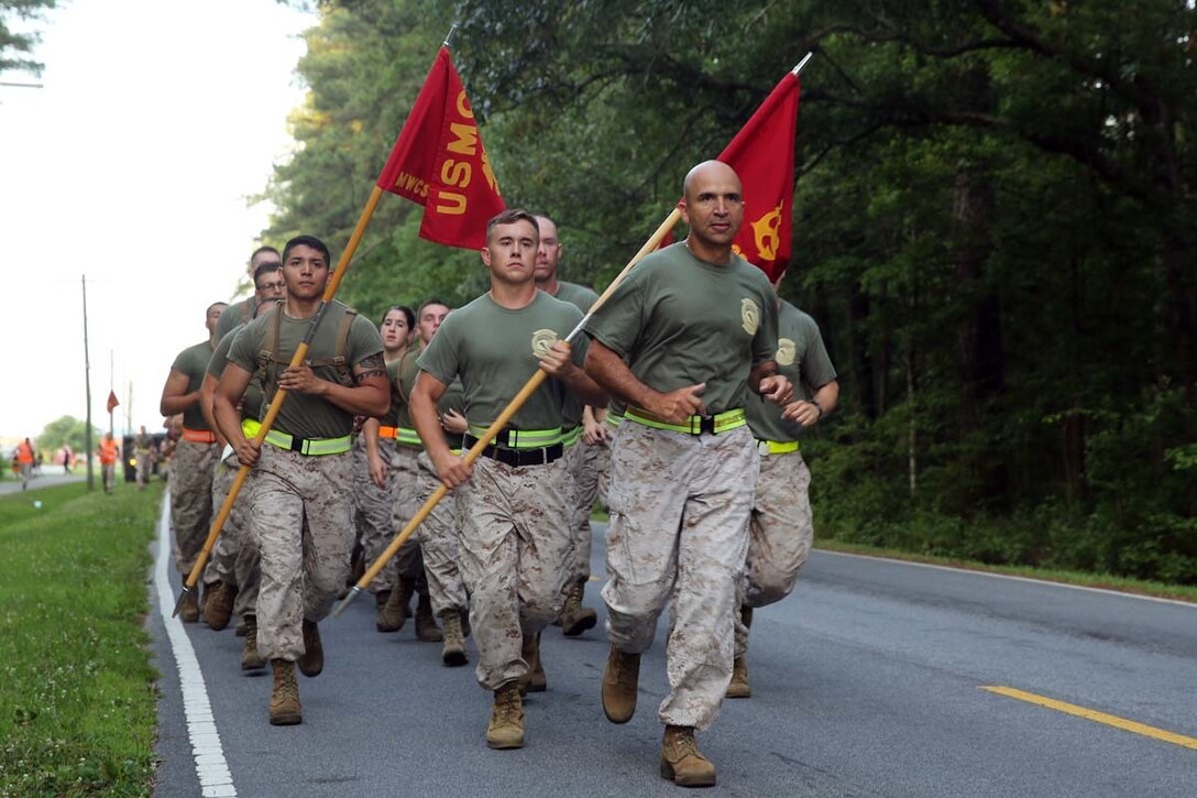 Lieutenant Col. Jamie Macias leads Marine Wing Communications Squadron 28 on a motivational run as the culminating event for the inaugural Spartan Cup at Marine Corps Air Station Cherry Point, N.C., June 19, 2014. The Spartan Cup is designed to inspire competiveness within the squadron, build esprit de corps and achieve balanced excellence. At the conclusion of the run, Macias announced Company B is the first to receive the Spartan Cup. Macias is the commanding officer of MWCS-28. The squadron plans to continue this ongoing competition crowning a winner semi-annually.