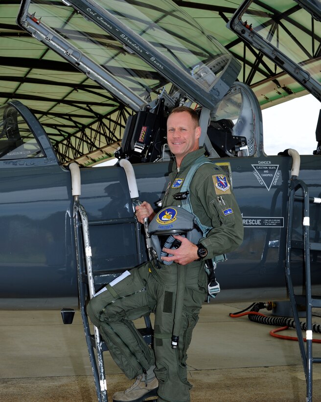 Col. Jim Sears, 14th Flying Training Wing Commander, stands next to the T-38 Talon before his “fini flight” June 27 at Columbus Air Force Base. Along with being the Base Commander, Sears was also an instructor pilot for the T-38. (U.S. Air Force photo/Elizabeth Owens)