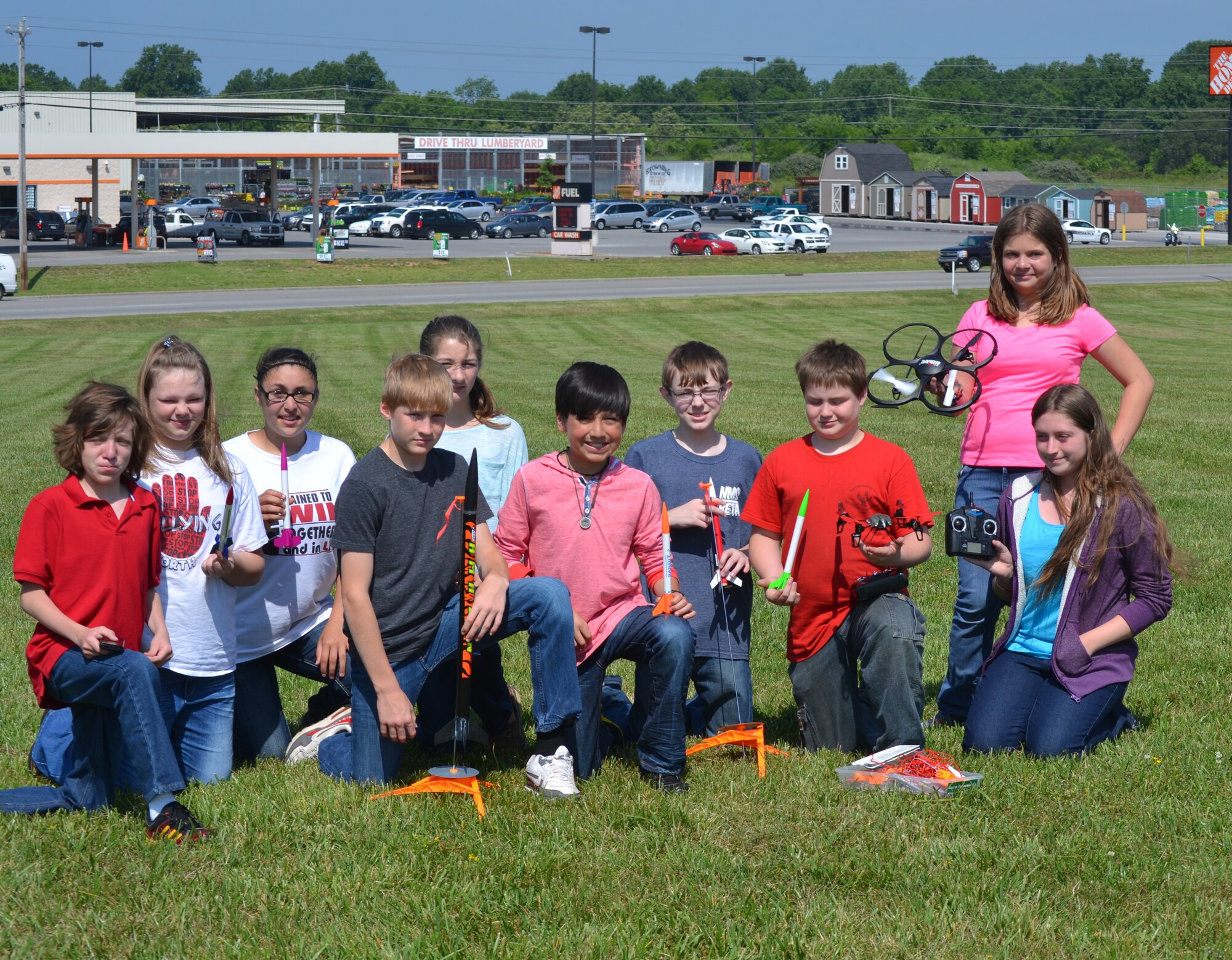 North Middle School students display rockets and an aerial drone used by the Rocket Club. Students shown left to right are Martin Bennett, Amber Tucker, Cassidy Escalon, Mason Mitchell, Kearra Schrader, Armando Montez, Zach Smith, Samuel Smith, Alexandria Little (standing) and Megan Payne. (Photos provided)