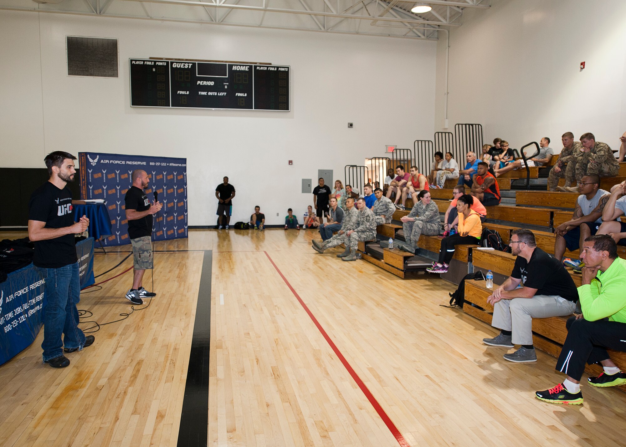 UFC Fit coach Mike Dolce and former UFC interim welterweight champion Carlos Condit answer questions at the Joint Base McGuire Dix Lakehurst Fitness Center, June 25, during an Air Force Recruiting sponsored fitness workshop. The workshop focused on improving fitness through setting goals, being accountable and proper diet. (U.S. Air Force photo/Christian DeLuca)