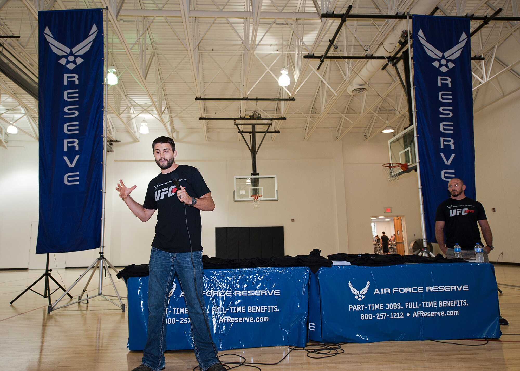 Former UFC interim welterweight champion Carlos Condit speaks to a crowd at the Joint Base McGuire Dix Lakehurst Fitness Center, June 25, during an Air Force Recruiting sponsored fitness workshop. The workshop focused on improving fitness through setting goals, being accountable and proper diet. (U.S. Air Force photo/Christian DeLuca)