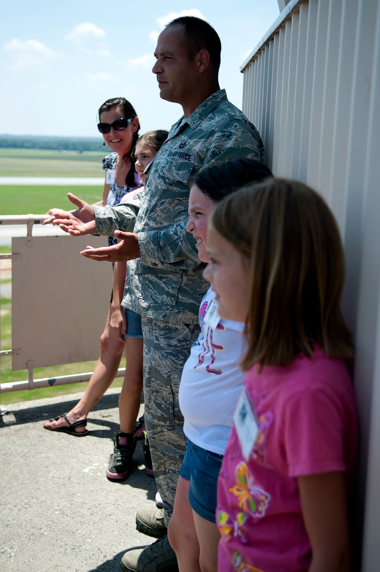Tech. Sgt. Shannon Grice, 4th Operation Support Squadron air traffic control watch supervisor, talks to the kids from Seymour Johnson’s Science and Technology Academies Reinforcing Basic Aviation and Space Exploration (STARBASE) program about the F-15E Strike Eagles landing and taking off, June 26, 2014, at Seymour Johnson Air Force Base, North Carolina. STARBASE is a collaborative effort between the base and the surrounding community to promote education and innovation. During the five-day program, local fifth-grade students study science, technology, engineering and mathematics disciplines beyond their current grade level. (U.S. Air Force photo/Airman 1st Class Shawna L. Keyes)