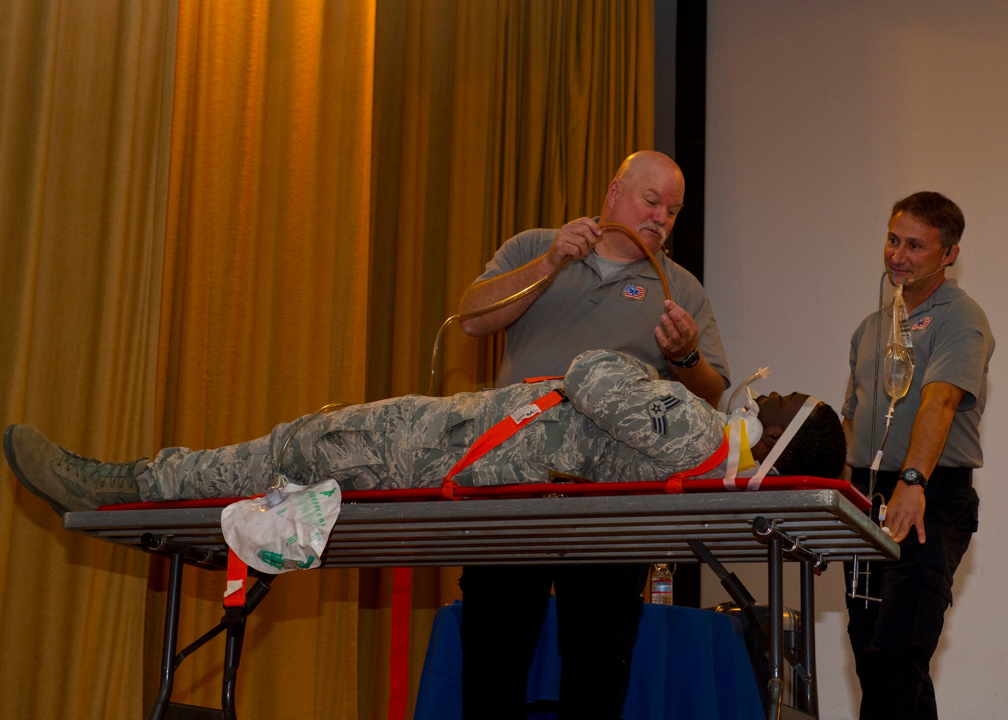 Greg McCarty and Vince Easevoli, Florida firefighter paramedics from the S.A.F.E. Inc., perform a demonstration showing the serious injuries a car accident can cause as a result of careless driving at Holloman Air Force Base, N.M., June 20. McCarty and Easevoli presented Street Smart, a brief dedicated to making young adults aware of the dangers of driving under the influence of alcohol or drugs, texting or emailing while driving, not wearing seat belts, and the trauma associated with these dangers. (U.S. Air Force photo by Airman 1st Class Leah Ferrante/Released)