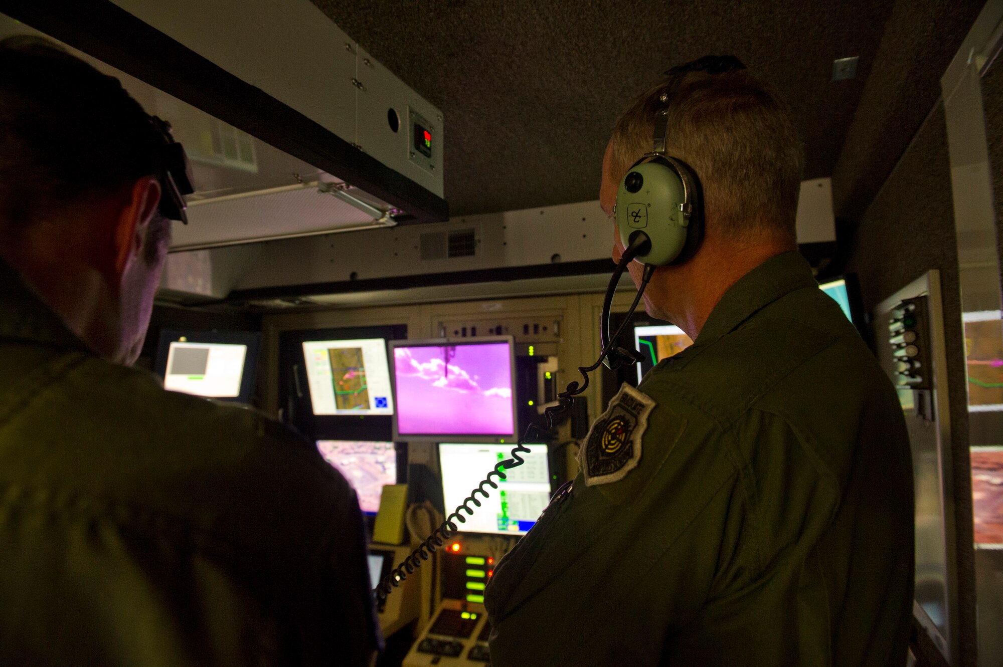 U.S. Air Force Gen. Mike Hostage, commander of Air Combat Command, gets a hands-on look at how a ground control station works during his visit at Holloman Air Force Base, N.M., June 25. Hostage toured the GCS to observe the capabilities of remotely piloted aircraft. (U.S. Air Force photo by Airman 1st Class Leah Ferrante/released) 