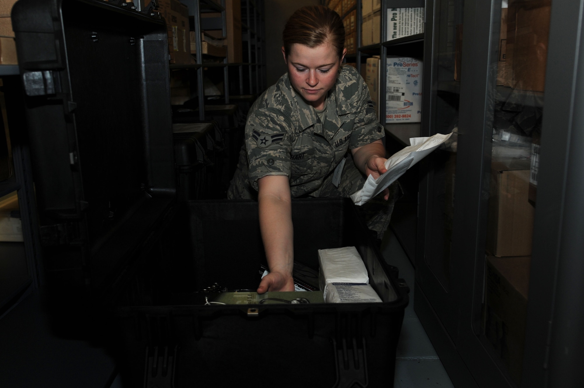 Airman 1st Class Brittany Hart, 19th Medical Support Squadron medical material technician, checks inventory June 19, 2014, at Little Rock Air Force Base, Ark. The medical logistics flight stores many items such as first aid kits used during deployments. (U.S. Air Force photo by Airman 1st Class Mercedes Muro) 