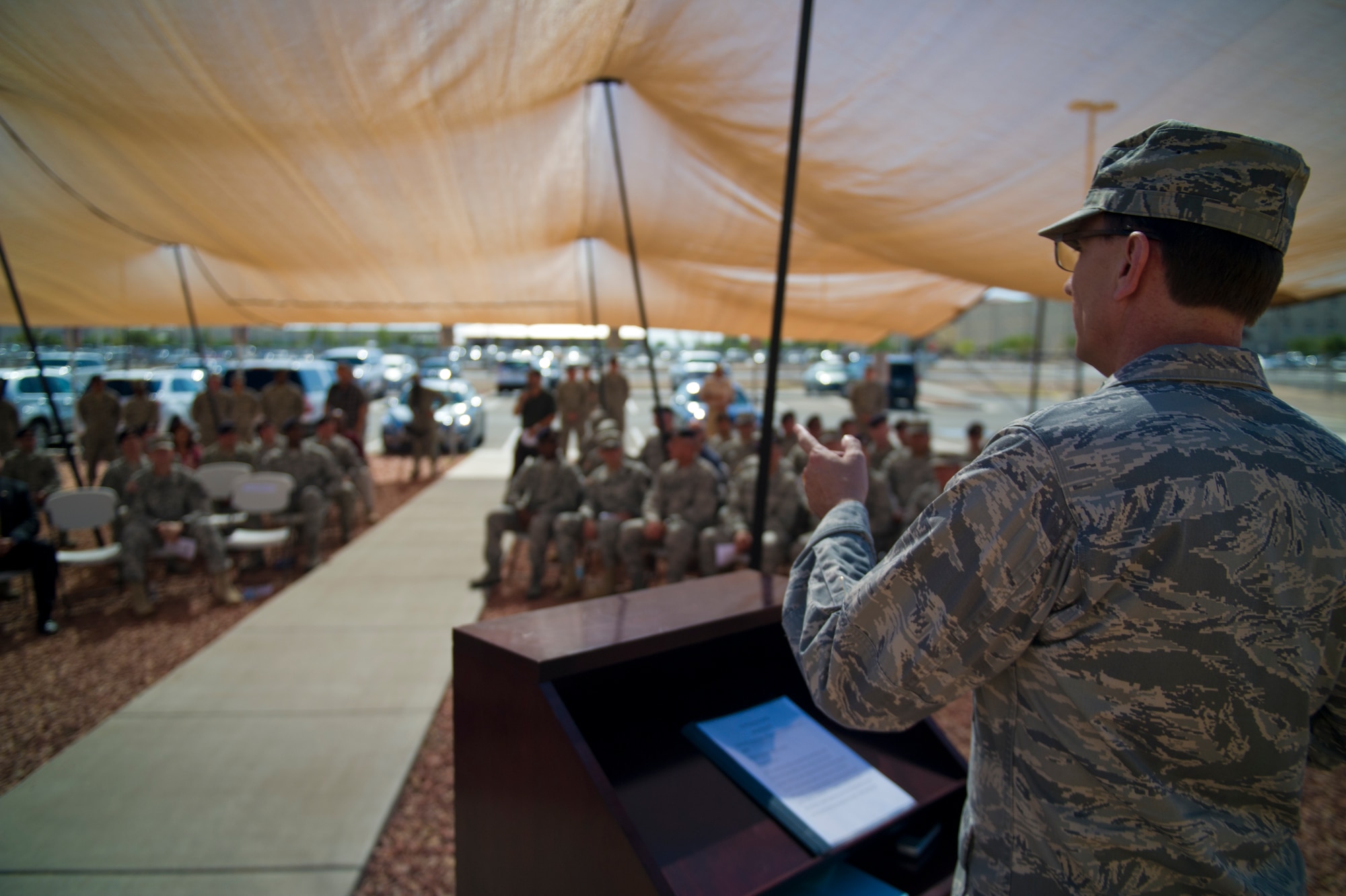 Major General Kenneth Wisian, deputy adjutant general of the Texas Air National Guard, addresses various military police personnel during the opening ceremony of the Ground Command Readiness Training Center assumption of command at Fort Bliss, Texas, June 26. The GCRTC consolidated a regional training center for all the military police personnel from both Air Force and Army to use to conduct required pre-deployment training. (U.S. Air Force photo by Airman 1st Class Aaron Montoya / Released)