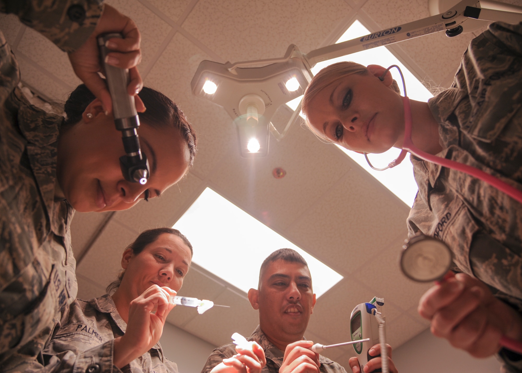 Independent duty medical technicians assigned to various Team Little Rock flying squadrons simulate the use of different medical instruments June 18, 2014, at Little Rock Air Force Base, Ark. The medical technicians are trained to operate in a deployed environment and are knowledgeable in many different fields of medicine. (U.S. Air Force photo by Airman 1st Class Harry Brexel) 