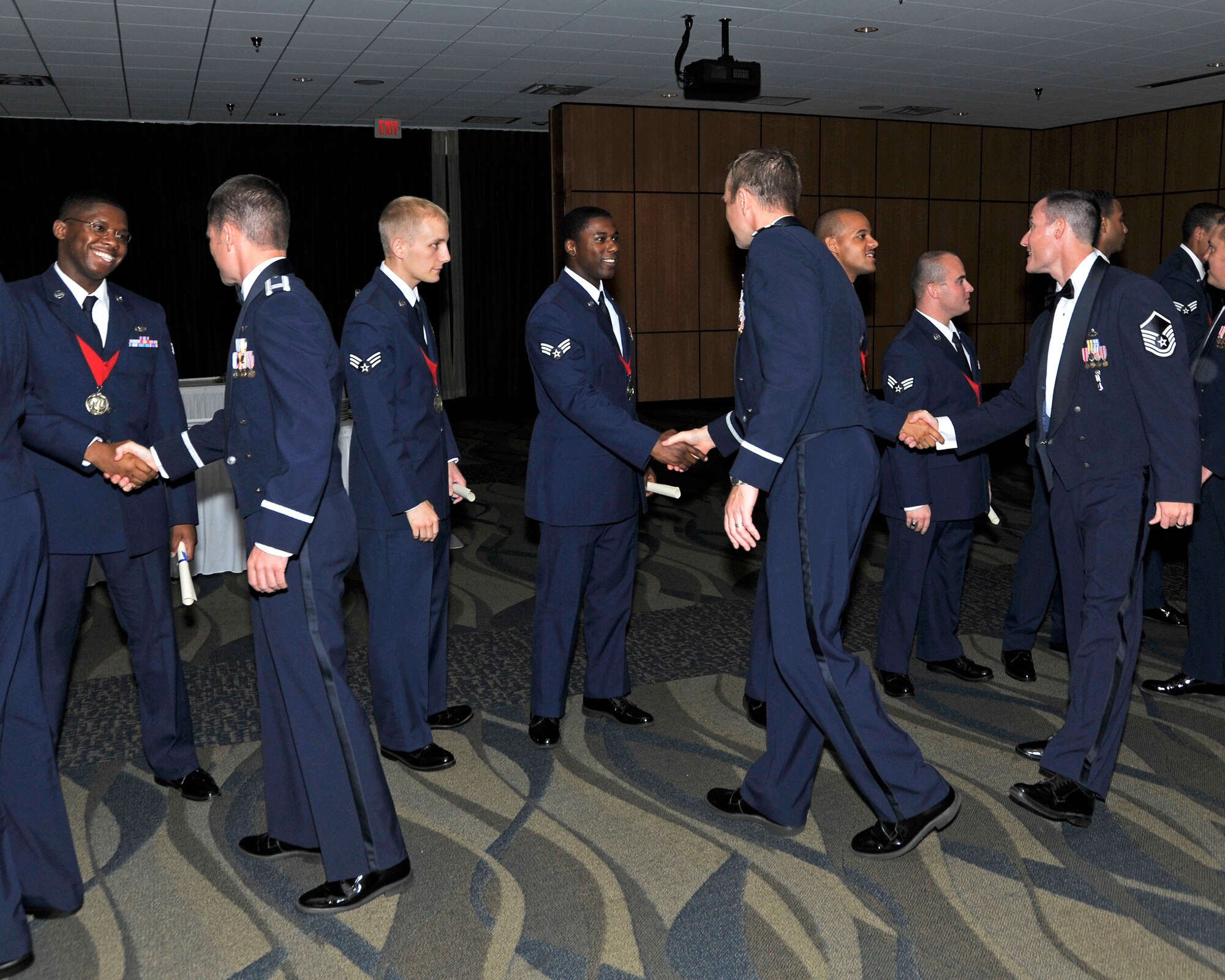 Team Tyndall members congratulate Advanced Leadership School class 14-5 graduates after their graduation ceremony June 26 at the Horizons Community Center. (U.S. Air Force photo by Airman 1st Class Sergio Gamboa)