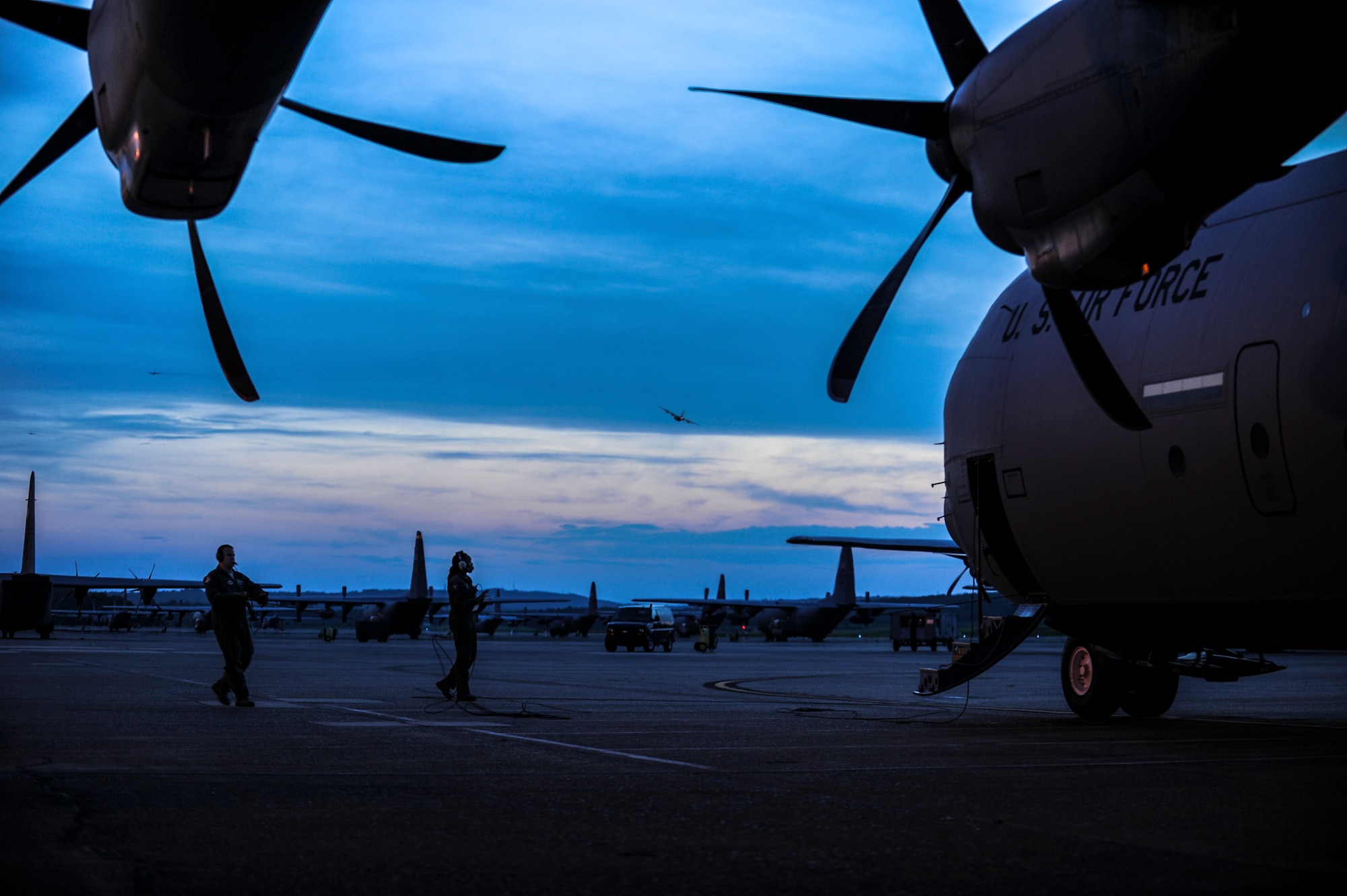 An instructor loadmaster from the 314th Airlift Wing walks an Airman through preflight checks June 20, 2014, at Little Rock Air Force Base, Ark. The C-130 Formal Training Unit, which consists of the 314th and 189th AWs, has the most experienced cadre of C-130 instructors in the world. (U.S. photo by Airman 1st Class Cliffton Dolezal)
