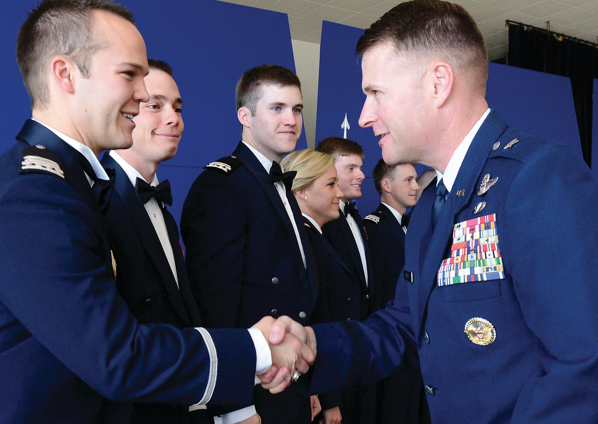 Then-Brig. Gen. Greg Lengyel, commandant of cadets, congratulates new Class of 2013 graduate Cadet 1st Class Scott Wooden during a summer graduation ceremony here in August 2013. Now a major general, Lengyel will soon depart the Academy  to serve as the  commander of Special Operations Command, Europe.(Mike Kaplan/U.S. Air Force photo)