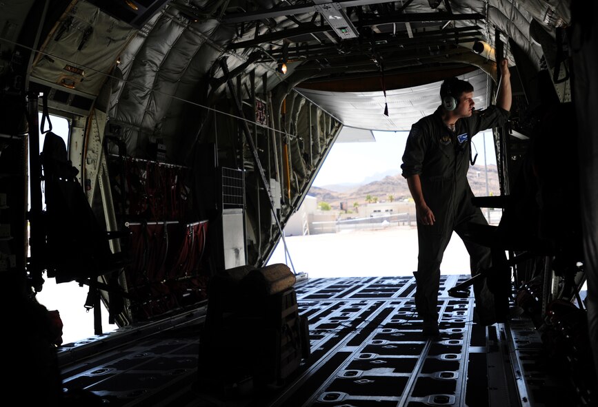 Senior Airman Spencer Smith, from the 37th Airlift Squadron, Ramstein Air Base, Germany, conducts pre-flight inspections on a C-130J Super Hercules aircraft before departing Creech Air Force Base, Nev., June 22, 2014.  Smith and other Airmen visited Creech AFB as part of Joint Forcible Entry, an exercise designed to enhance service cohesiveness between the U.S. Army and Air Force. Both services work together to properly execute large scale heavy equipment and troop movement. (U.S. Air Force photo by Senior Master Sgt. Cecilio Ricardo/Released)

