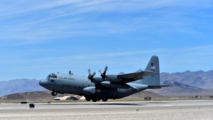 A C-130H Hercules aircraft takes off from Creech AFB, Nev., June 22, 2014.  Twelve C-130H and C-130J model aircraft participated in Joint Forcible Entry, an exercise designed to enhance service cohesiveness between the U.S. Army and Air Force. Both services work together to properly execute large scale heavy equipment and troop movement. (U.S. Air Force photo by 1st Lt. Stephani Schafer/Released)

