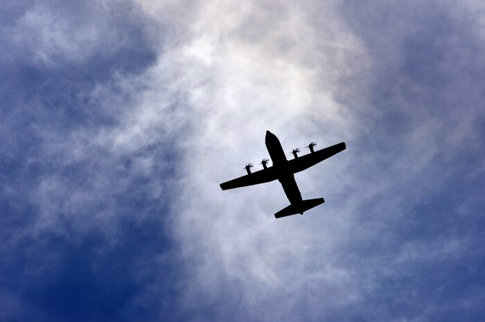A C-130J Super Hercules flies overhead as it prepares to land at Creech Air Force Base, Nev., during Joint Forcible Entry June 21, 2014. The joint airdrop exercise is designed to enhance service cohesiveness between the U.S. Army and Air Force. It gives both services an opportunity to properly execute large scale heavy equipment and troop movement. (U.S. Air Force photo by Tech. Sgt. Nadine Barclay/Released)

