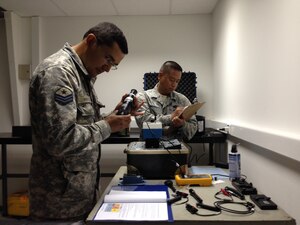 Tech. Sgt. Fernando Marinas, 366th Component Maintenance Squadron Precision Measurement Equipment Laboratory test measurement and diagnostic equipment laboratory chief, watches as members from the Fuerza Aérea de Chile work April 8, 2014. The individuals part of the Fuerza Aérea de Chile were ready to work and receptive to the training. (Courtesy photo)