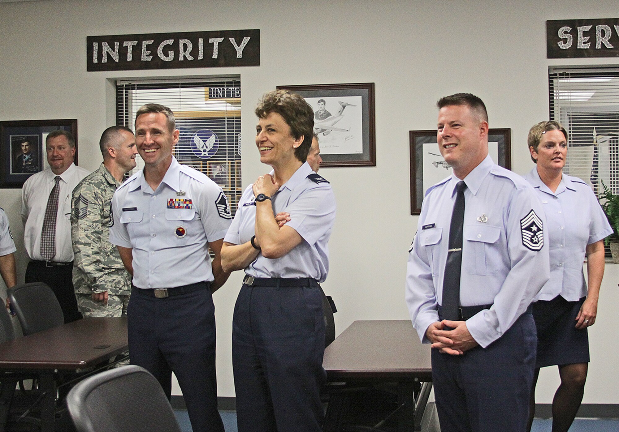 Col. Cassie Barlow, 88 Air Base Wing commander, discusses the benefits of the newly relocated Airman Leadership School (ALS) with Master Sgt. Jason Goodspeed, ALS commandant, 88 Force Support Squadron (left) and Chief Master Sgt. Charles Hoffman, 88 ABW command chief (right). The ALS was dedicated June 23 in Bldg. 1226, Area A (Photo by Tara Dixon Engel).