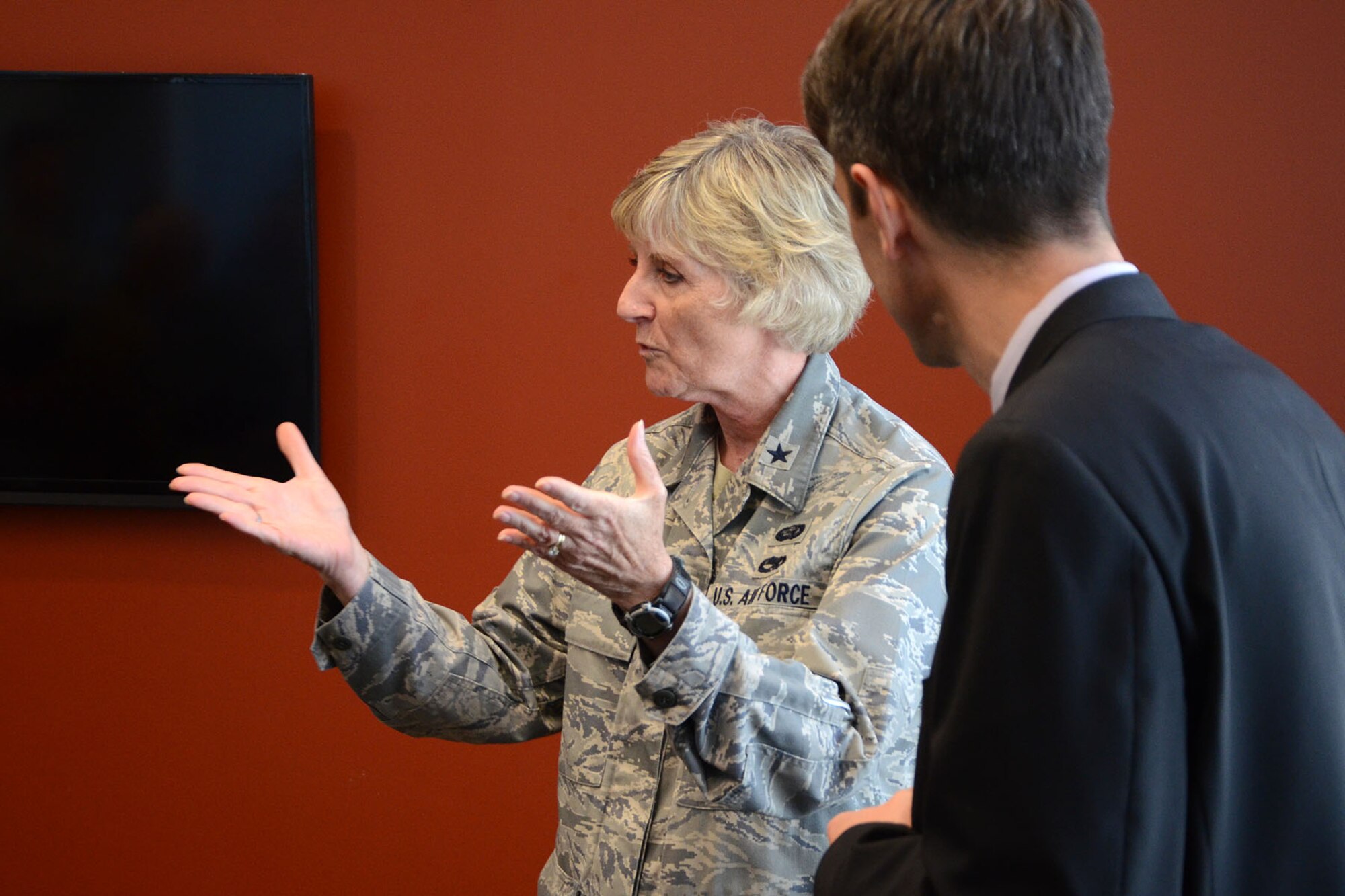 PEASE AIR NATIONAL GUARD BASE, N.H. – Brigadier Gen. Carolyn Protzmann, New Hampshire Air National Guard commander, speaks to Brad Bowman, the senior military legislative assistant for U.S. Senator Kelly Ayotte, and others during Bowman’s visit to the base June 27. Bowman was the award for his dedicated efforts in obtaining funding for the Deployment Cycle Support – Care Coordination Program and the 157 ARW’s quest to receive the KC-46A refueling tanker while in his role as senior military legislative lead to the senator. (N.H. Air National Guard photo by Tech. Sgt. Mark Wyatt)