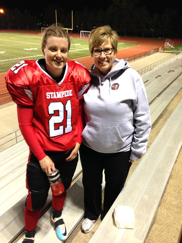 1st Lt. Delaney Kiernan, left, from the 55th Contracting Squadron at Offutt Air Force Base, Neb. poses for a photo at a game earlier this season. (Courtesy photo/Nebraska Stampede)