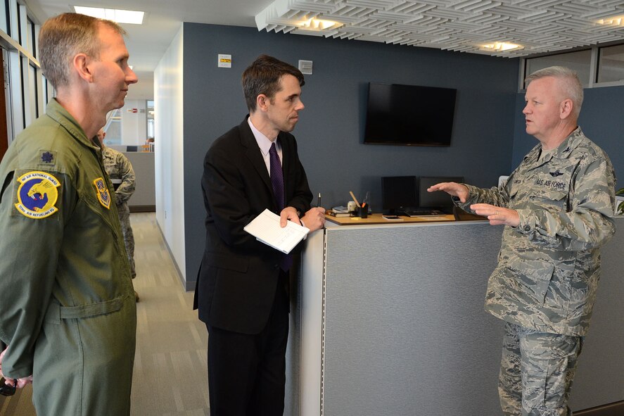 PEASE AIR NATIONAL GUARD BASE, N.H. – Colonel Paul Hutchinson, 157th Air Refueling Wing commander, discusses the many environmental-friendly features of the new 157th Operations Group building to Brad Bowman, the senior military legislative assistant for U.S. Senator Kelly Ayotte, during a visit to the base June 27. During the visit, N.H. Army National Guard Lt. Col. Roy Hunter, president of the National Guard Association of N.H., presented Bowman the General John Stark Award. Bowman was instrumental in the 157 ARW obtaining funding for the Deployment Cycle Support – Care Coordination Program and the wing’s quest to receive the KC-46A refueling tanker while in his role as senior military legislative lead to the senator. (N.H. Air National Guard photo by Tech. Sgt. Mark Wyatt)