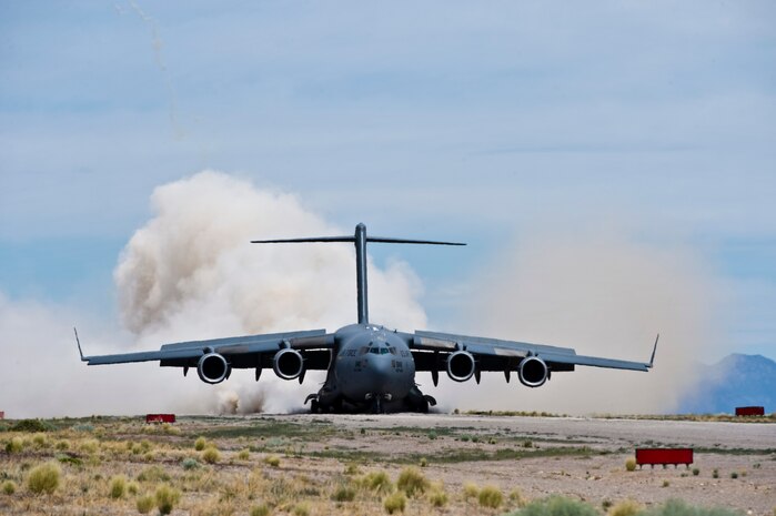 A U.S. Air Force C-17 Globemaster lands during a USAF Weapons School Joint Forcible Entry exercise June 21, 2014, at the Nevada Test and Training Range. The JFE is the USAFWS culminating advanced integration phase sortie for the C-17 and C-130 weapons instructor courses. (U.S. Air Force photo by Senior Airman Christopher Tam)