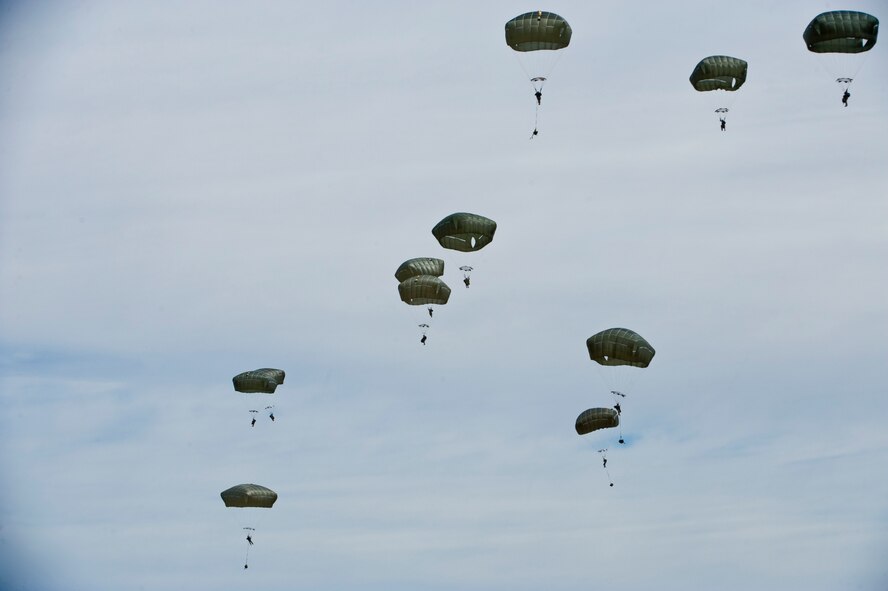 Jumpers from the U.S. Army 82nd Airborne Division, Fort Bragg, N.C., parachute out of a C-17 Globemaster during a U.S. Air Force Weapons School Joint Forcible Entry exercise June 21, 2014, over the Nevada Test and Training Range. The 82nd Airborne Division participated in the exercise for a joint integration with the U.S. Air Force to set the entry conditions for the forcible entry. (U.S. Air Force photo by Senior Airman Christopher Tam)