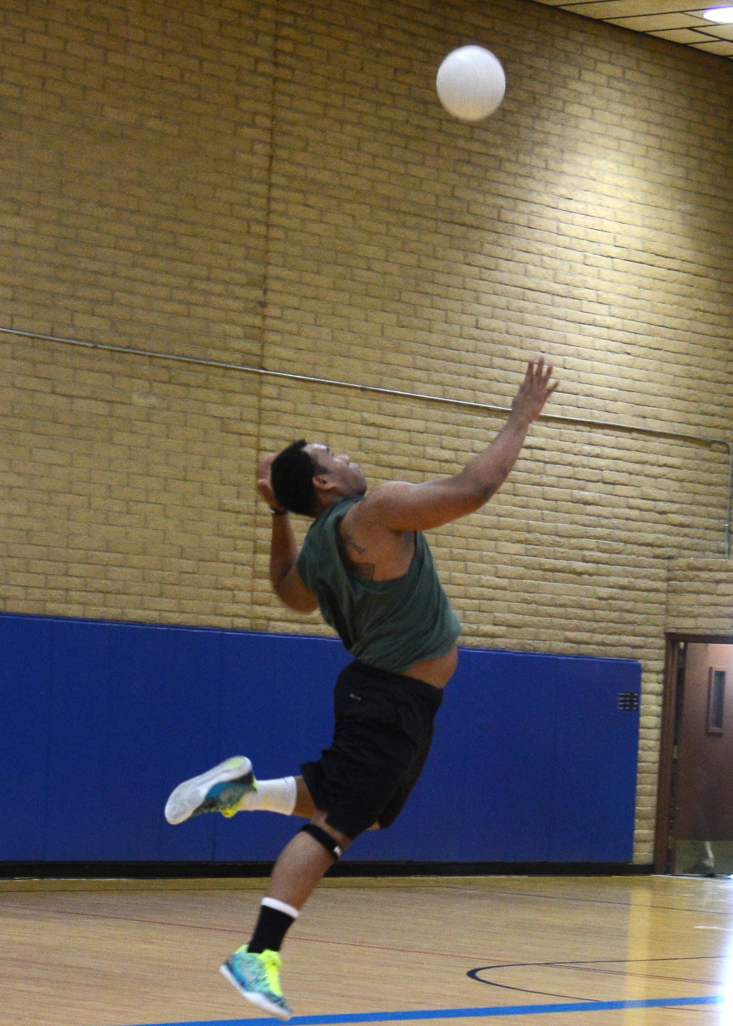 Christopher Brown, 56th Operation Support Squadron, prepares to return the serve during a game with 56th Force Support Squadron June 16 at Luke Air Force Base. OSS won two out of three games to win the match. (U.S. Air Force photo/Senior Airman Devante Williams)