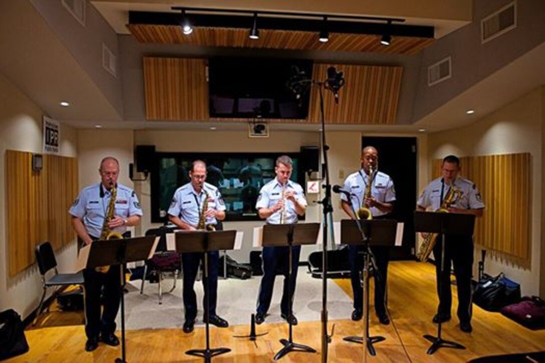 The saxophone section of the Airmen of Note performing in the studio for Interlochen Public Radio in Interlochen, Mich., on Thursday, June 26, while on tour through the Midwest. In addition to this performance, members of the ensemble were also interviewed live on the air. (U.S. Air Force photo by SMSgt Kevin Burns/released)