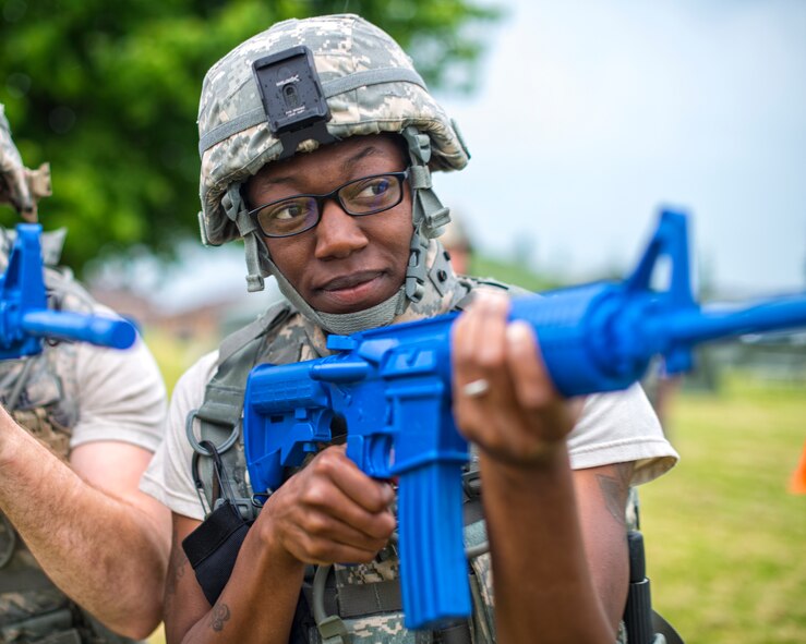 Members of the 914th Security Forces exchange best practices with local law enforcement officers during a weeklong weapons training exercise, June 8, 2014, Niagara Falls Air Reserve Station, N.Y. From global deployments to the ability to share specialized training with first responders; exercises like this are just one of the many ways the 914th Airlift wing contributes to the community. (U.S. Air Force photo by Tech. Sgt. Joseph McKee)