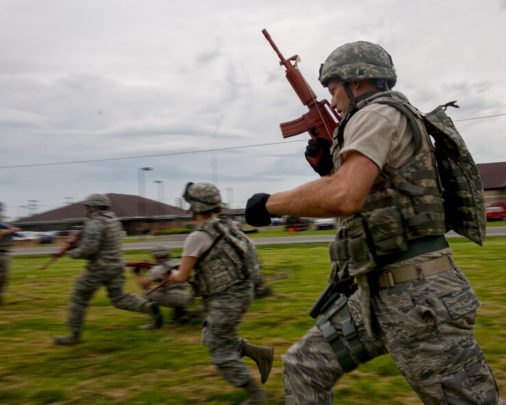 Members of the 914th Security Forces exchange best practices with local law enforcement officers during a weeklong weapons training exercise, June 8, 2014, Niagara Falls Air Reserve Station, N.Y. From global deployments to the ability to share specialized training with first responders; exercises like this are just one of the many ways the 914th Airlift wing contributes to the community. (U.S. Air Force photo by Tech. Sgt. Joseph McKee)