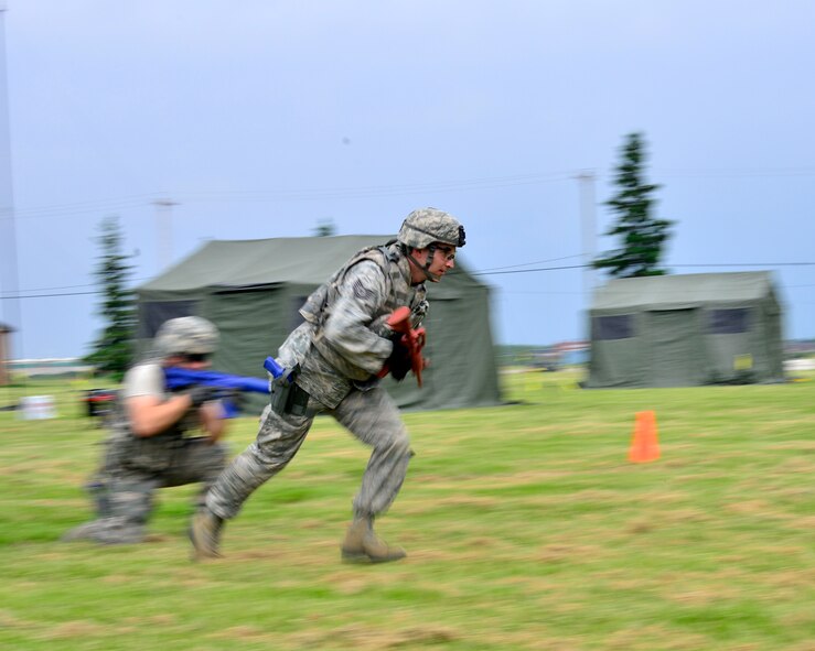 Members of the 914th Security Forces exchange best practices with local law enforcement officers during a weeklong weapons training exercise, June 8, 2014, Niagara Falls Air Reserve Station, N.Y. From global deployments to the ability to share specialized training with first responders; exercises like this are just one of the many ways the 914th Airlift wing contributes to the community. (U.S. Air Force photo by Tech. Sgt. Joseph McKee)