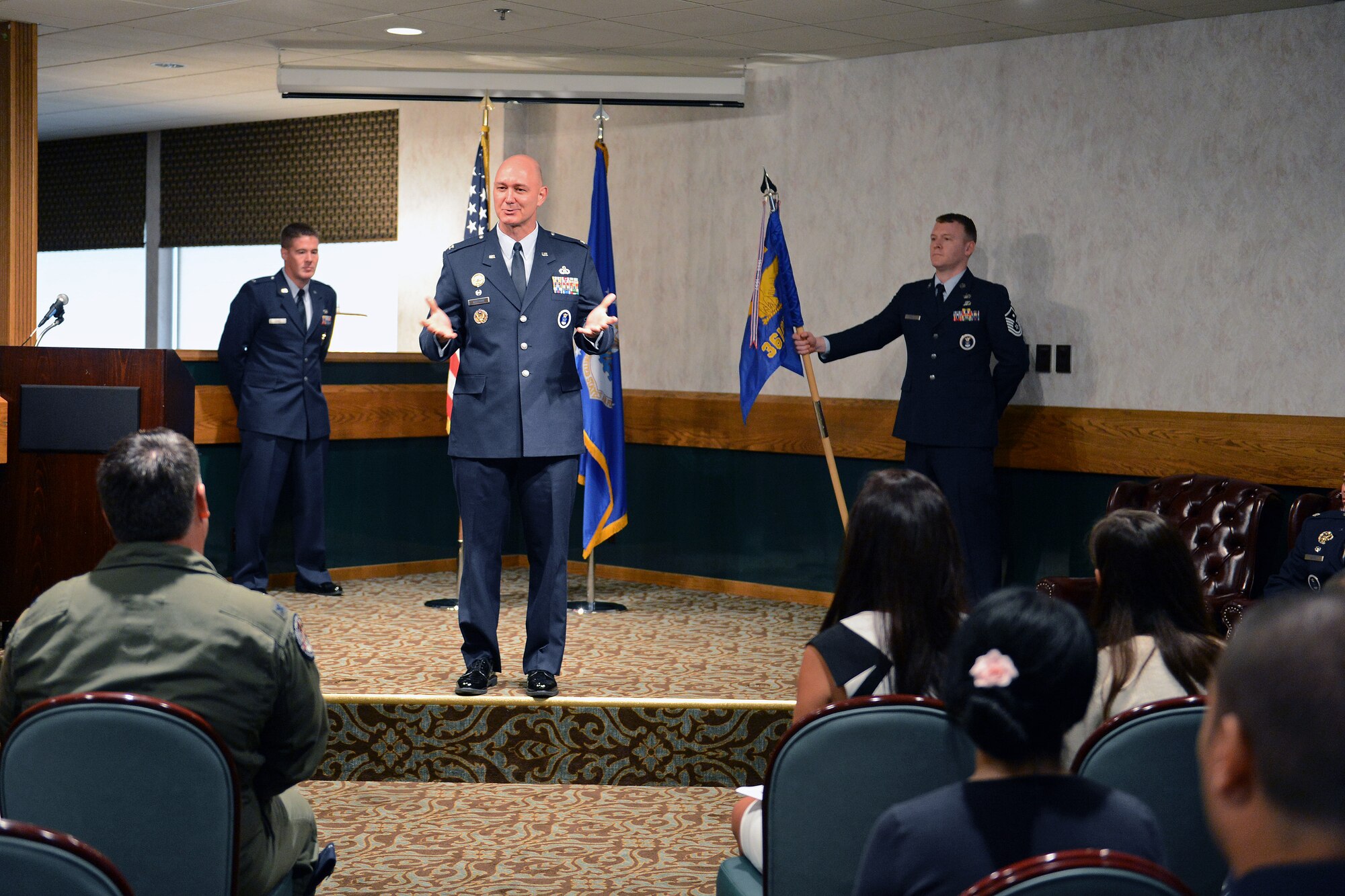 Col. Frederick Williams, 372nd Recruiting Group commander, praises Airmen of the 361st Recruiting Squadron at a change of command ceremony June 26, 2014, at Joint base Lewis-McChord, Wash. Williams presided over the ceremony in which Lt. Col. Jason Scott assumed command of the squadron from Lt. Col. Mitchell Dixon. (U. S. Air Force photo/Airman 1st Class Jacob Jimenez)