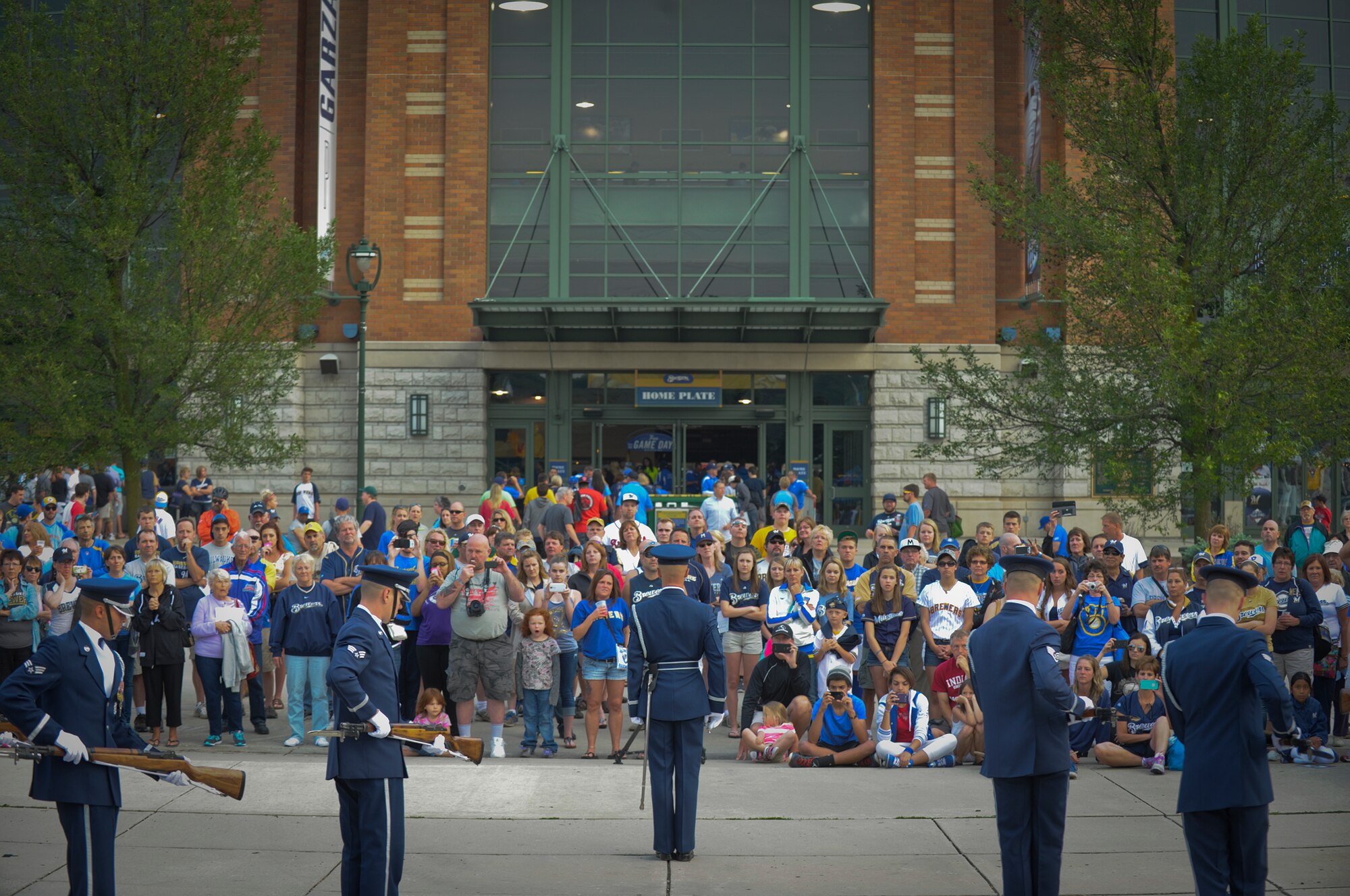 The United States Air Force Honor Guard Drill Team completes its performance at Miller Park in Milwaukee, June 23, 2014. The drill team is on a nine-day, seven-city tour with the Air Force band rock ensemble Max Impact across Wisconsin, Minnesota, South Dakota, Wyoming and Nebraska.  (U.S. Air Force Photo /1st Lt. Nathan Wallin)