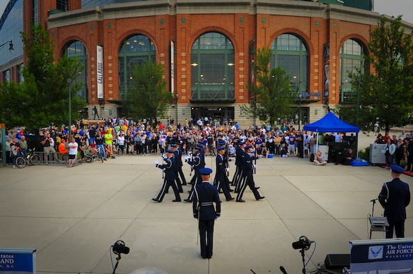 The United States Air Force Honor Guard Drill Team begins its presentation at Miller Park in Milwaukee prior to the Brewers game against the Washington Nationals June 23, 2014. The drill team is on a nine-day, seven-city tour with the Air Force band rock ensemble "Max Impact" across Wisconsin, Minnesota, South Dakota, Wyoming and Nebraska. (U.S. Air Force Photo/ 1st Lt. Nathan Wallin)