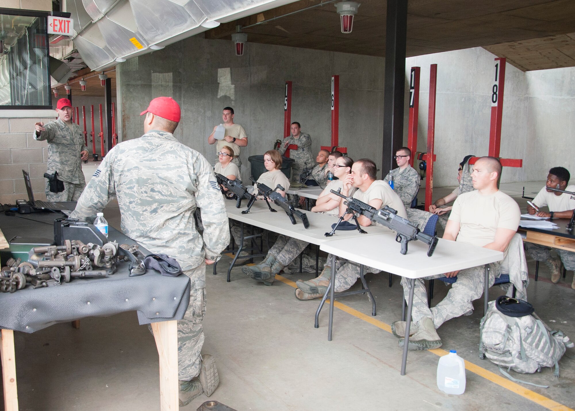 Staff Sgt. Ryan Duerr, 436th Security Forces Squadron combat arms instructor, teaches a class June 25, 2014 on Dover Air Force Base, Del. Combat Arms Training and Maintenance, or CATM, maintain all weapons for the base as well as teach airmen deploying the fundamentals and techniques of the weapons they will be using downrange. (U.S. Air Force photo/Senior Airman Jared Duhon) 