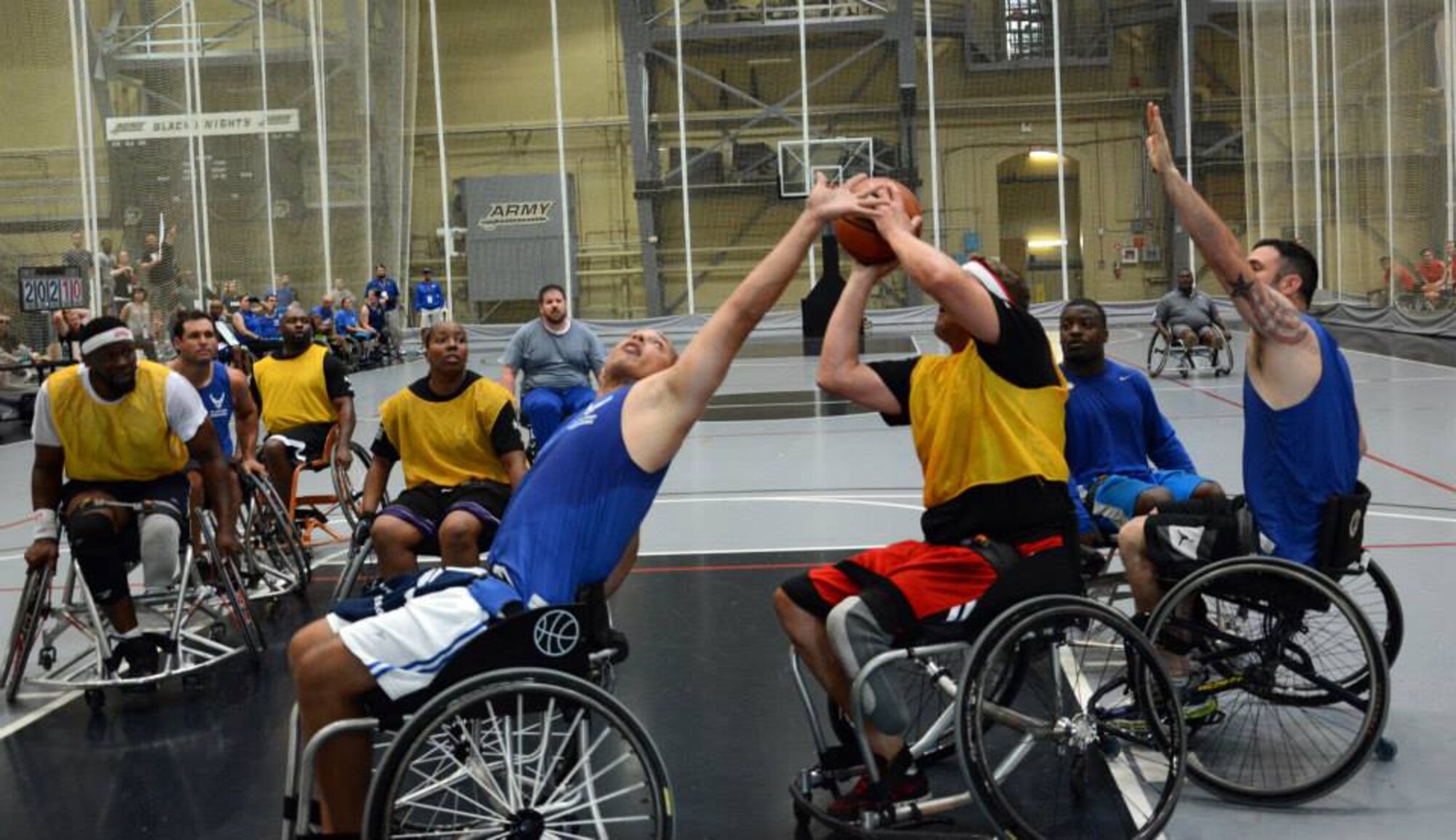 Army Master Sgt. Daniel Hendrix from Fort Carson, Colorado, wins the battle for the ball against Air Force opponents during the game opener of the wheelchair basketball competition June 16 at the 2014 U.S. Army Warrior Trials at West Point, New York.  Team Army took the win over the Air Force team. (U.S. Army photo/Gloria Montgomery) 