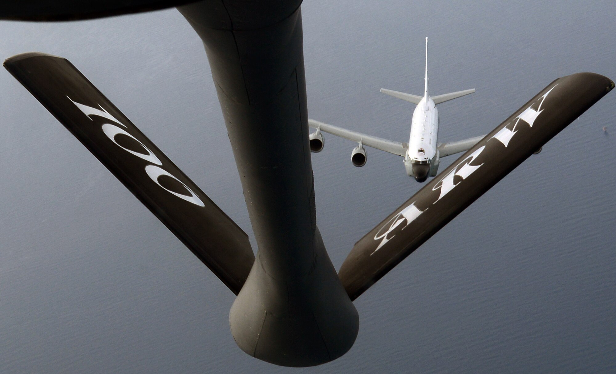 A Royal Air Force RC-135 Rivet Joint breaks away after receiving fuel from a U.S. Air Force KC-135 Stratotanker assigned to the 100th Air Refueling Wing, RAF Mildenhall, England, June 26, 2014, off the coast of England. This was the 100th ARW’s first RAF RC-135 refueling mission. (U.S. Air Force photo/Airman 1st Class Jonathan Light/Released)