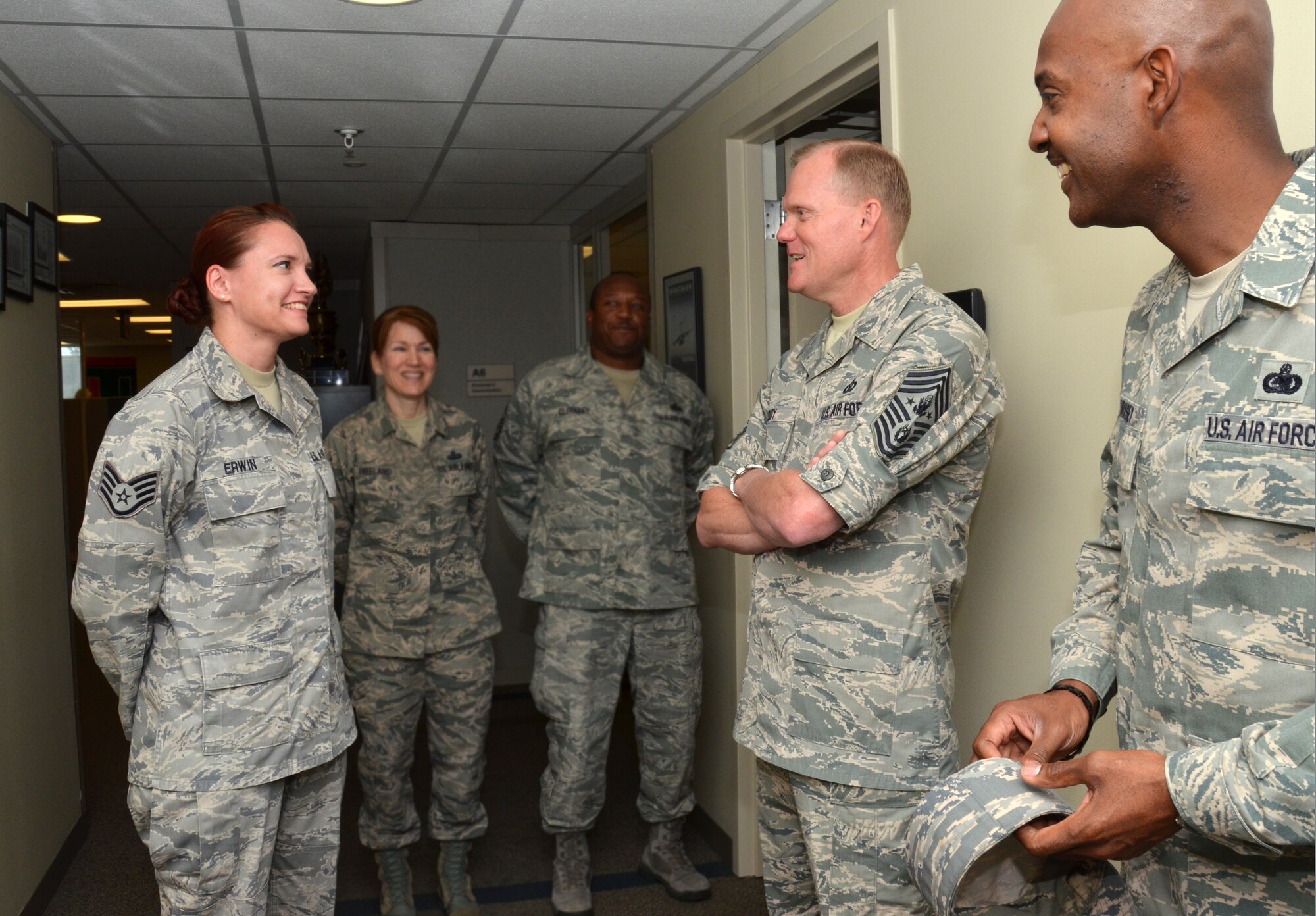 Staff Sgt. Melissa Erwin, left, Air Force Reserve Command communications, speaks with Chief Master Sgt. of the Air Force James Cody during his visit to Robins Air Force Base, Ga., June 24, 2014. Cody “coined” Erwin for her outstanding efforts with the American Red Cross. (U.S. Air Force photo/Staff Sgt. Kelly Goonan)