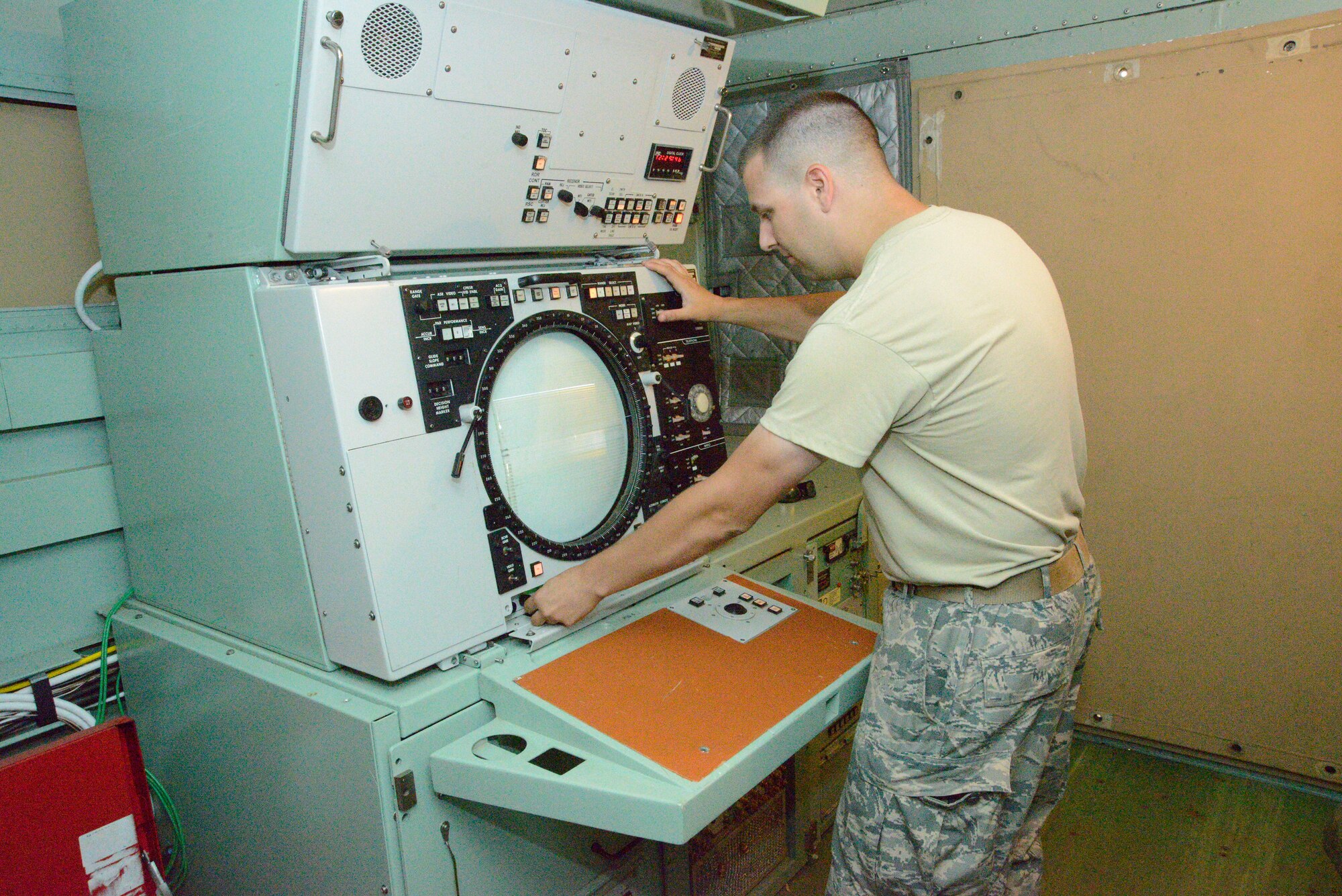 Senior Airman Cody Perschbacher, 53rd Ground Radar Systems maintainer, operates the Precision Approach Radar during the exercise. (U.S. Air Force photo by Ed Aspera)
