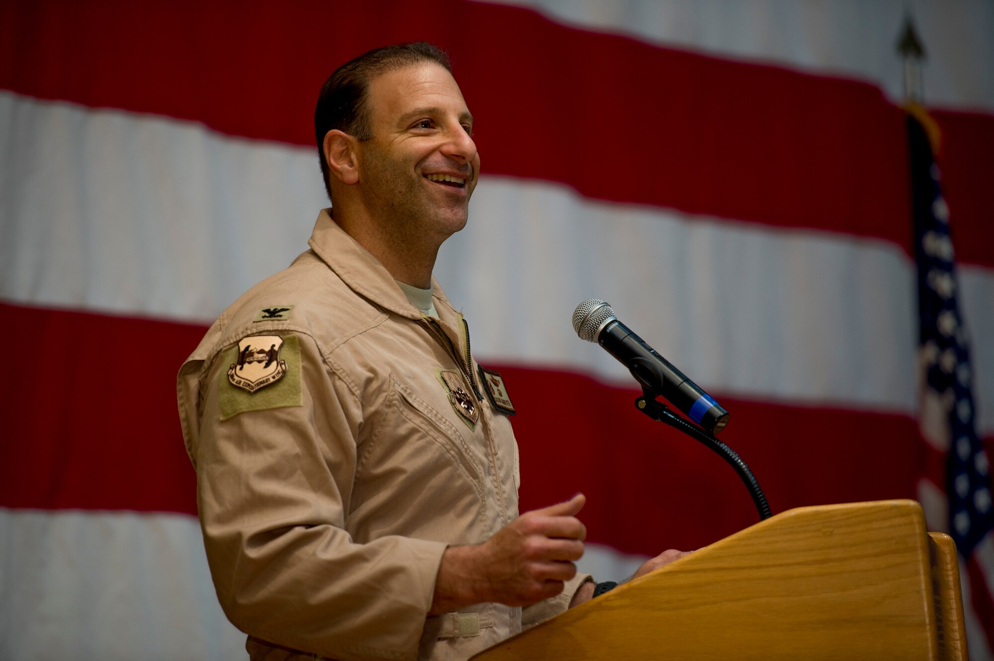 U.S. Air Force Col. Jason Hanover speaks to Airmen after assuming command of the 386th Air Expeditionary Wing during a formal change of command ceremony June 26, 2014 at an undisclosed location in Southwest Asia. Hanover assumed command after serving as the military assistant to the commander, NATO Special Operations Headquarters, Supreme Headquarters Allied Powers Europe in Belgium. (U.S. Air Force photo by Staff Sgt. Jeremy Bowcock)