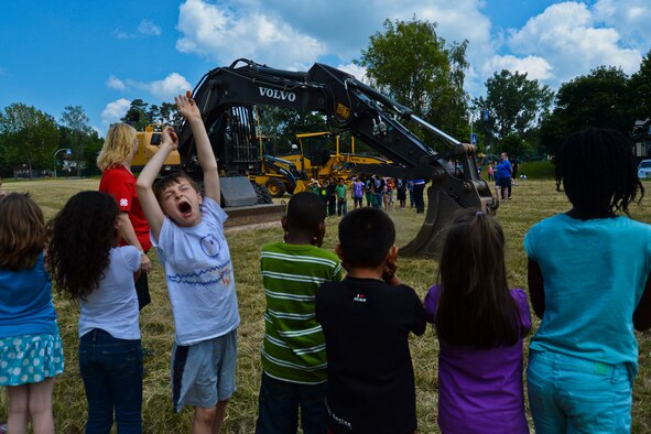 Children attending the 52nd Force Support Squadron’s School Age Program participate in the 52nd Civil Engineer Squadron’s Career Day outside the SAP building at Spangdahlem Air Base, Germany, June 18, 2014. The SAP offers a variety of activities for children to do throughout the summer. (U.S. Air Force photo by Staff Sgt. Joe W. McFadden/Released) 