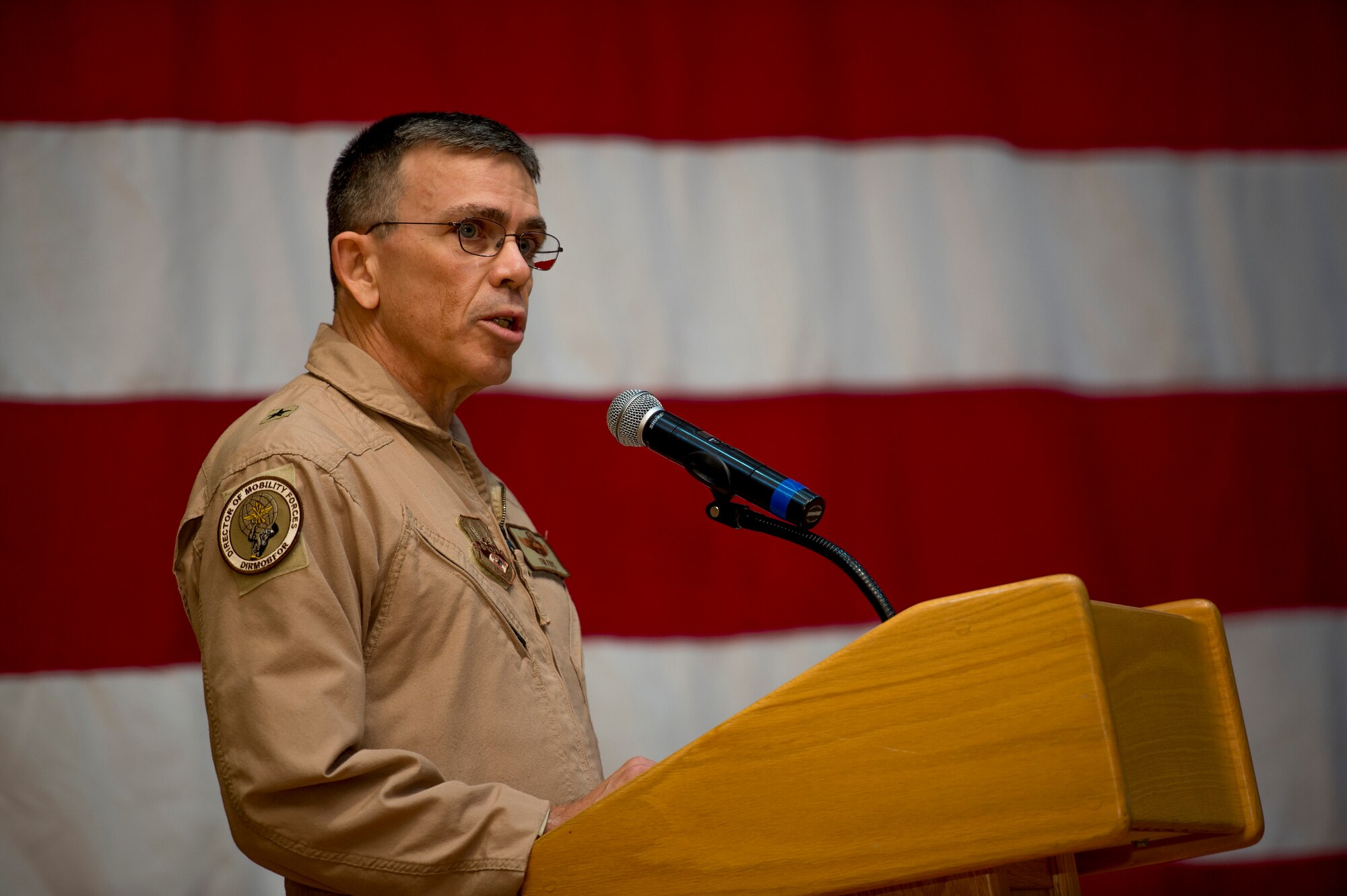U.S. Air Force Brig. Gen. Timothy Frye, mobility forces director, speaks to Airmen as the presiding official over the 386th Air Expeditionary Wing change of command ceremony June 26, 2014. During the ceremony, Col. John Klein, 386th AEW commander, relinquished command to Col. Jason Hanover. (U.S. Air Force photo by Staff Sgt. Jeremy Bowcock)