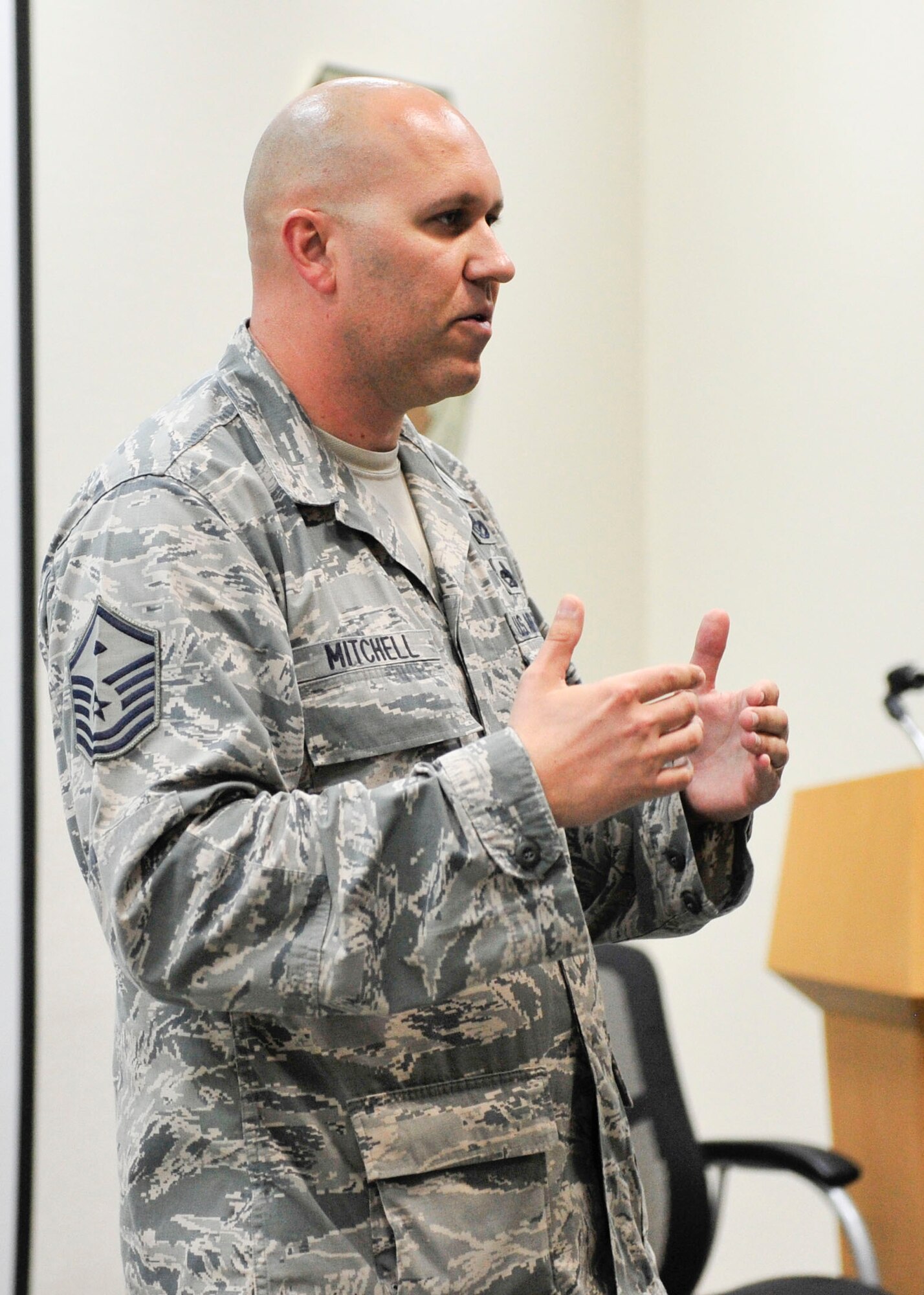 U.S. Air Force Master Sgt. Jeremy Mitchell, 379th Expeditionary Operations Support Squadron first sergeant shares his experiences with attendees during a Desert Diamond Symposium at Al Udeid Air Base, Qatar, June 22, 2014. Course curriculum ranged from explaining first sergeant responsibilities to administrative paperwork, how to deal with Article 15 processing to domestic violence and sexual assault response. (U.S. Air Force photo by Senior Airman Colin Cates)