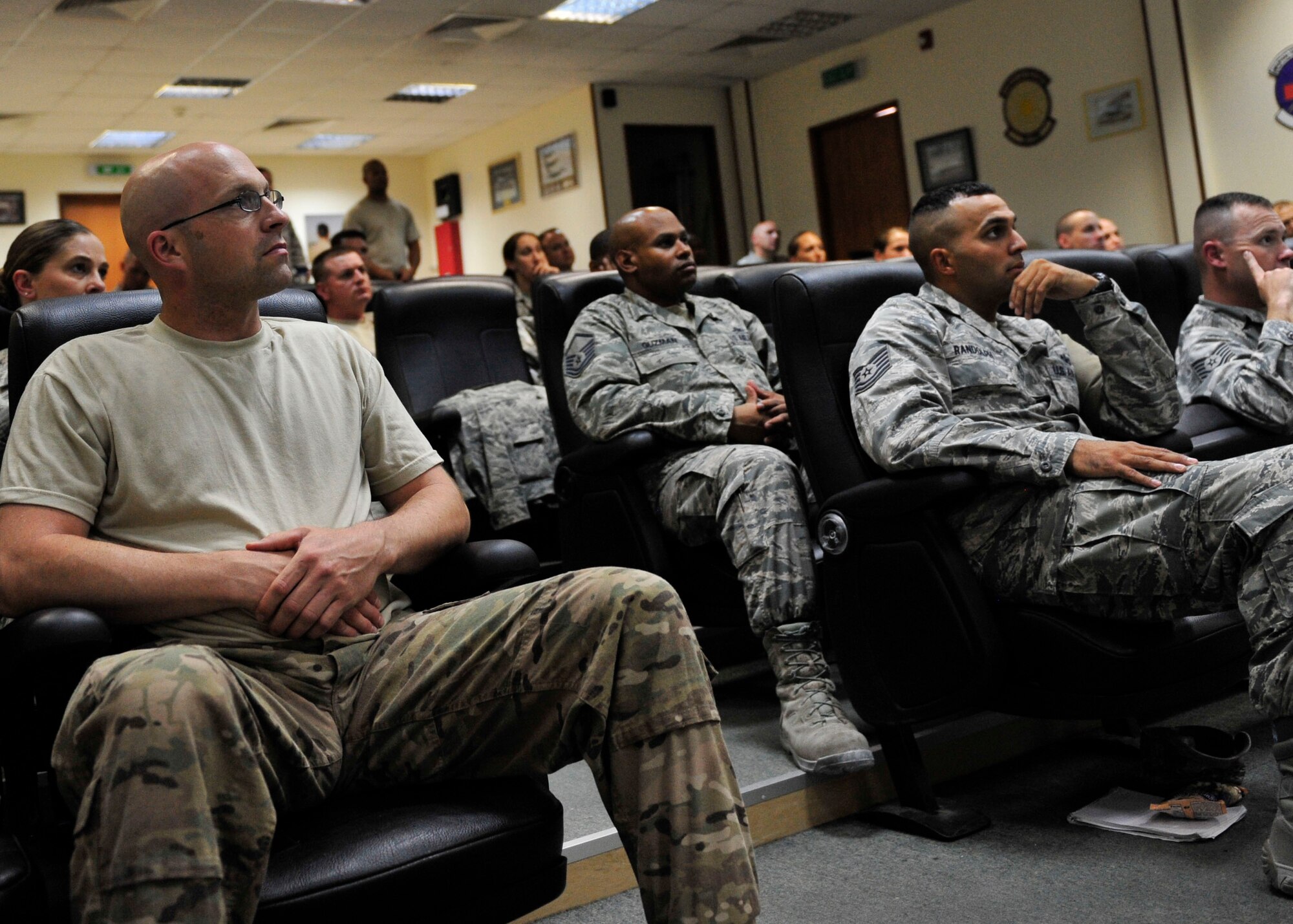 U.S. Air Force Airmen listen about the duties and responsibilities of a first sergeant during a Desert Diamond Symposium at Al Udeid Air Base, Qatar, June 22, 2014. The two-day course was designed to provide information and tools to aspiring first sergeants. (U.S. Air Force photo by Senior Airman Colin Cates) 