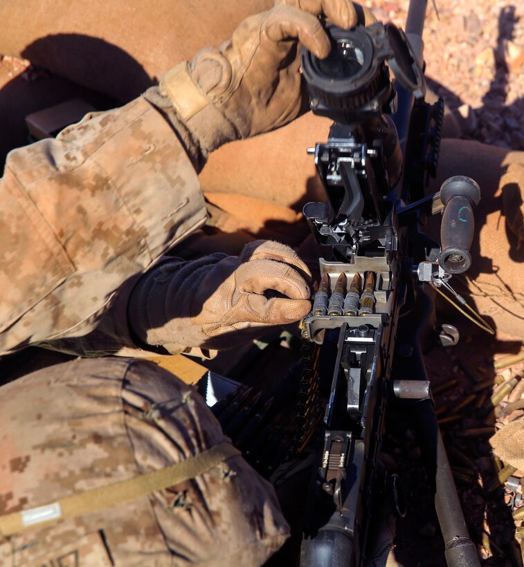 U S Marine Corps Lance Cpl Ian Martinez Makes Adjustments Before Firing His M240 Medium