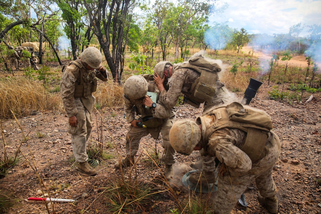 U.S. Marines fire an 81mm mortar system during a crewed-served weapons competition on Mount Bundey Training Area, Australia, June 19, 2014.