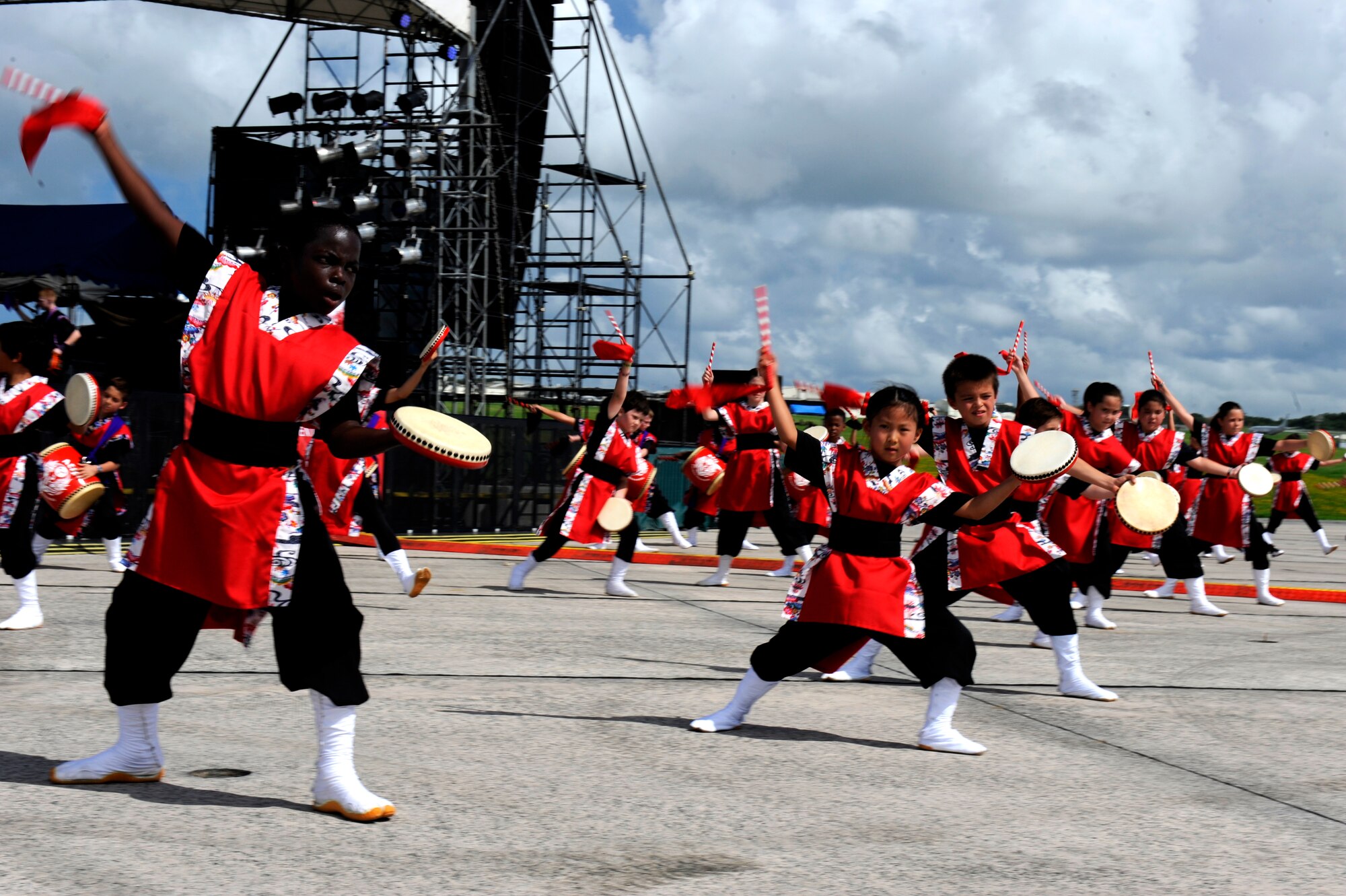 Drummers from the Firebirds Taiko Drum Club perform during AmericaFest 2014 on Kadena Air Base, Japan, June 28, 2014. The two-day event is designed to build a positive relationship between U.S. military forces on Okinawa and the local population in a fun and informal environment, while offering a first-hand look at a traditional Fourth of July celebration. (U.S. Air Force photo by Senior Airman Maeson L. Elleman)