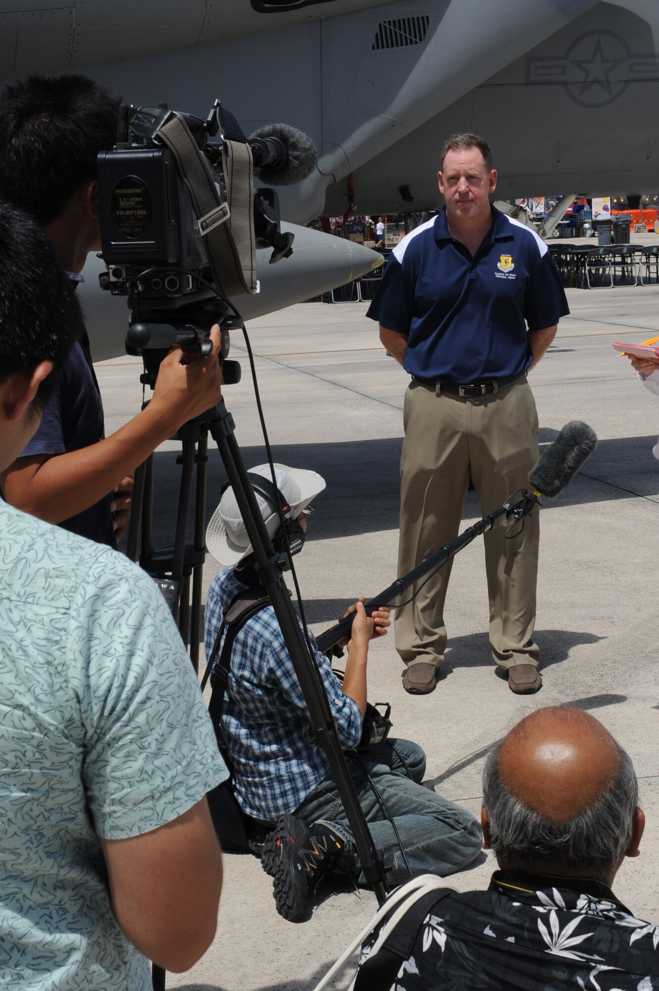 U.S. Air Force Brig. Gen. James Hecker, 18th Wing commander, speaks to local media representatives during an AmericaFest press conference on Kadena Air Base, Japan, June 28, 2014. Hecker used the opportunity to explain the purpose of the two-day event, which is to foster positive relations between the U.S. military forces on Okinawa and the local community, as well as thank the organizations that helped make AmericaFest happen. (U.S. Air Force photo by Airman 1st Class Zade C. Vadnais)