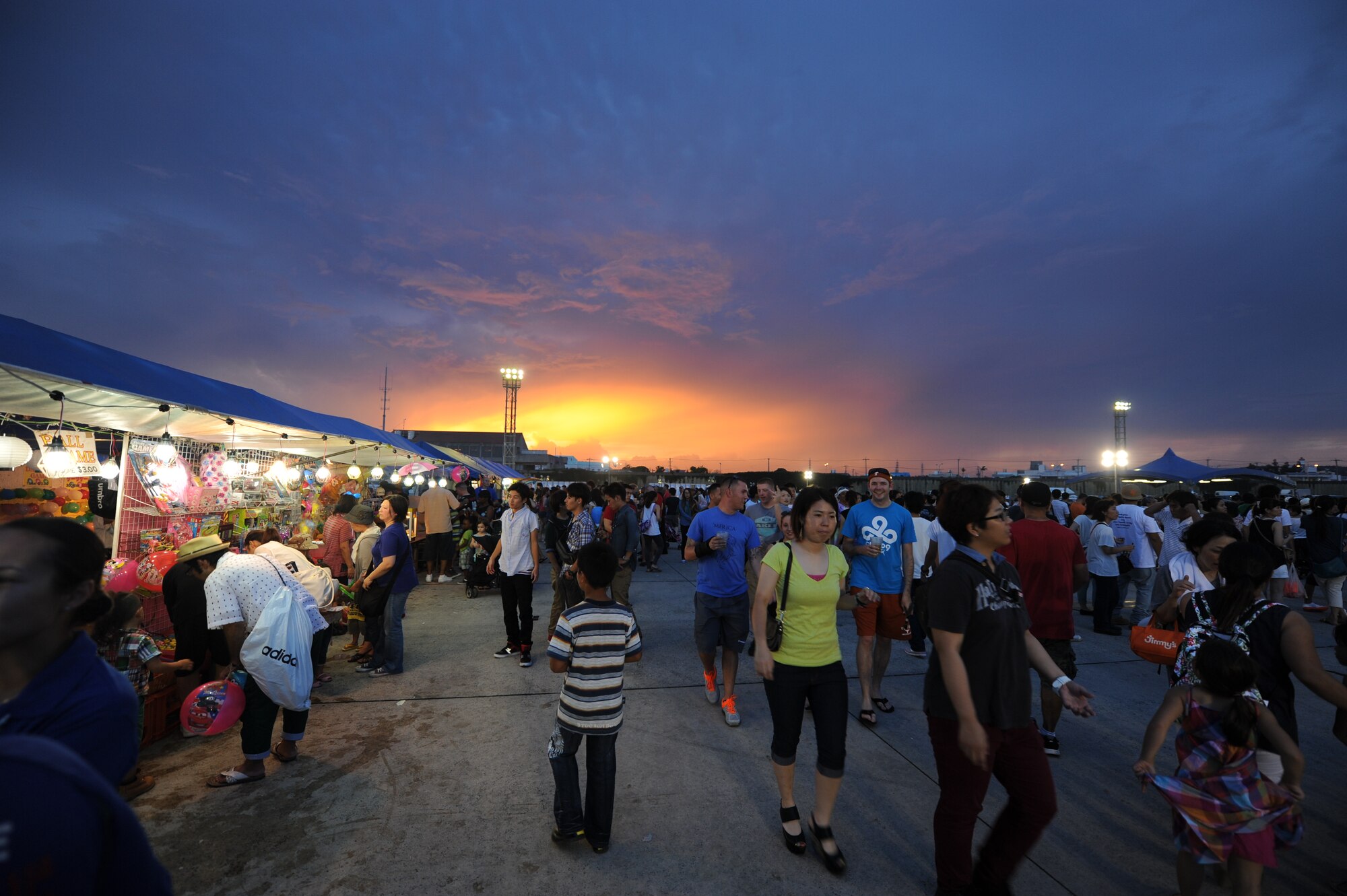 Thousands of festival goers enjoy the 38th Annual AmericaFest celebrating U.S. Independence Day on Kadena Air Base, Japan, June 29, 2014. AmericaFest is an Independence Day celebration showcasing various Japanese and U.S. military aircraft. There were also games, food, live performances and other entertainment for AmericaFest attendees to enjoy. (U.S. Air Force Photo by Airman 1st Class Stephen G. Eigel)