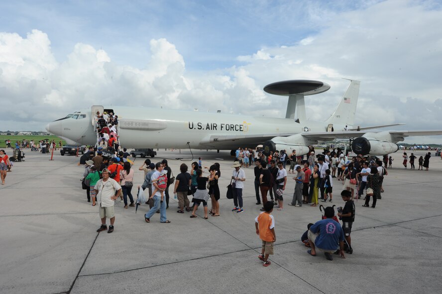 Japanese and U.S. festival goers tour an E-3 Sentry during AmericaFest 2014 at Kadena Air Base, June 29, 2014. AmericaFest celebrated U.S. Independence Day and showcased various Japanese and U.S. military aircraft. There were also games, food, live performances and other entertainment for AmericaFest attendees to enjoy. (U.S. Air Force photo by Airman 1st Class Stephen G. Eigel)