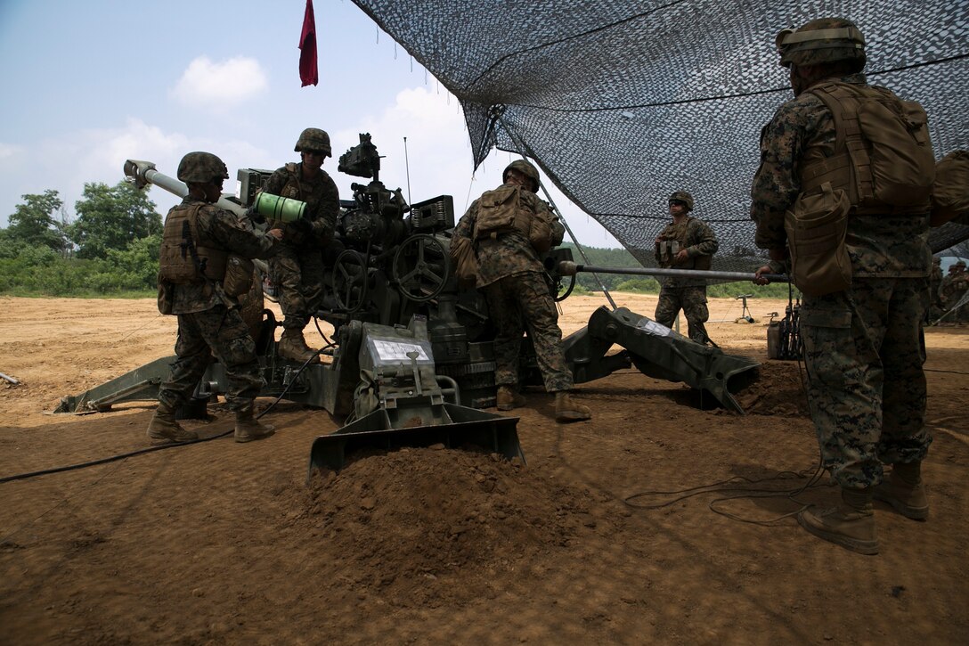 Marines load an M777A2 lightweight 155 mm howitzers June 14 at Warrior Base, Munsan, South Korea, during Korean Marine Exchange Program 14-7. The U.S. Marines and the Republic of Korea Marines trained together on how to operate each other’s artillery equipment. KMEP 14-7 is one iteration in a series of continuous combined training exercises designed to enhance the ROK-U.S. alliance, promote stability on the Korean Peninsula, and strengthen the ROK-U.S. military capabilities and interoperability. The Marines are with Battery K, 3rd Battalion, 12th Marine Regiment, 3rd Marine Division, III Marine Expeditionary Force.