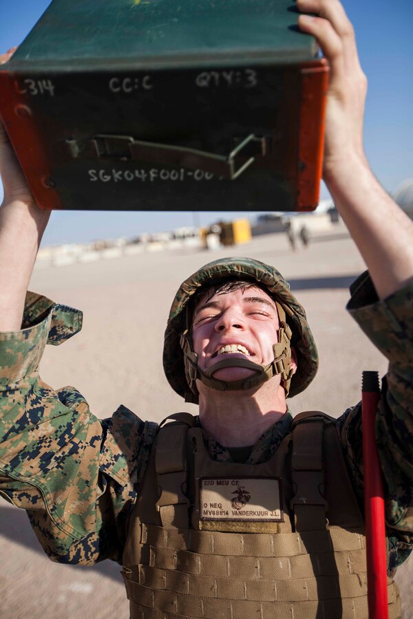 U.S. 5TH FLEET AREA OF RESPONSIBILITY (June 27, 2014) U.S. Marine Corps Cpl. John Vanderkuur, 22nd Marine Expeditionary Unit (MEU) data network specialist and native of Davison, Mich., lifts an ammo can during a physical conditioning drill as part of martial arts training. The Marines are conducting previously scheduled sustainment training to maintain proficiency and a high degree of readiness. The 22nd MEU is deployed with the Bataan Amphibious Ready Group as a theater reserve and crisis response force throughout U.S. Central Command and the U.S. 5th Fleet area of responsibility. (U.S. Marine Corps photo by Sgt. Austin Hazard/Released)